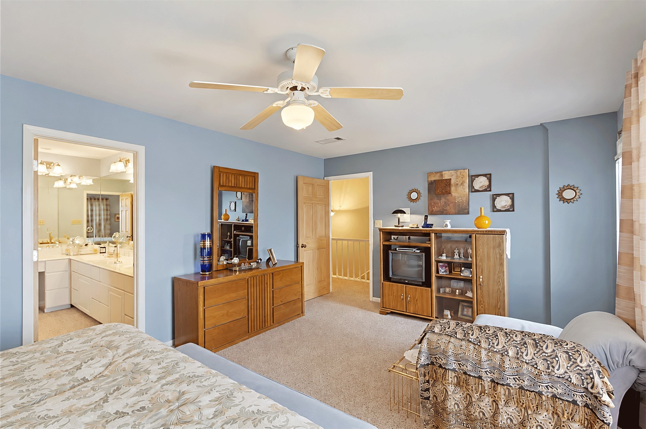 Spacious primary bedroom upstairs with room for a sitting area.