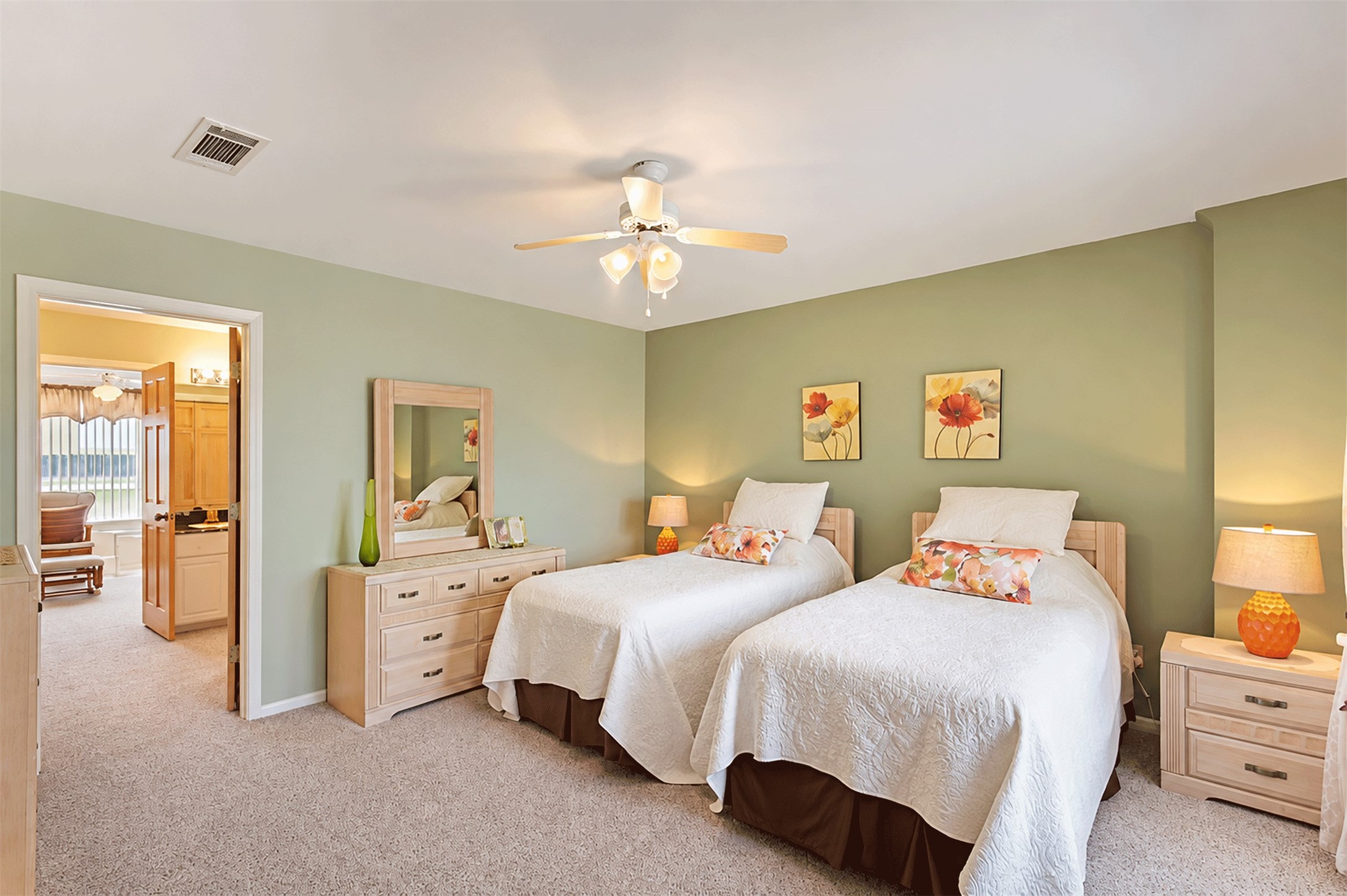 Roomy upstairs bedroom that connects through a Jack and Jill bath to a second large bedroom.