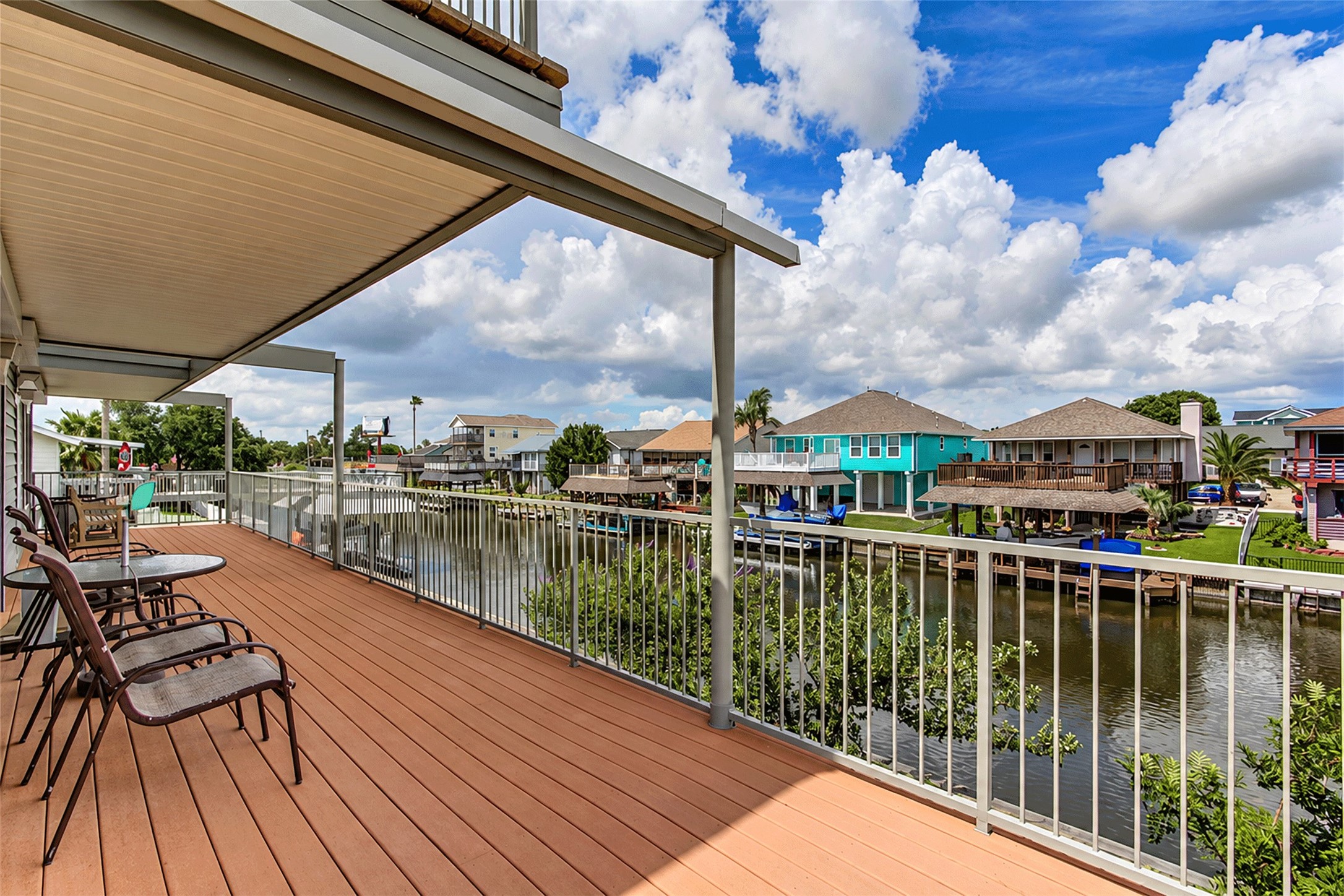 Covered deck with open canal views across the neighborhood.