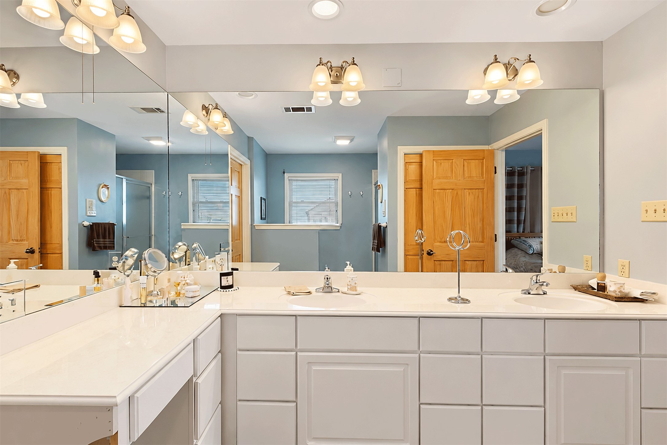 Primary bath with an abundance of counter space and cabinetry.