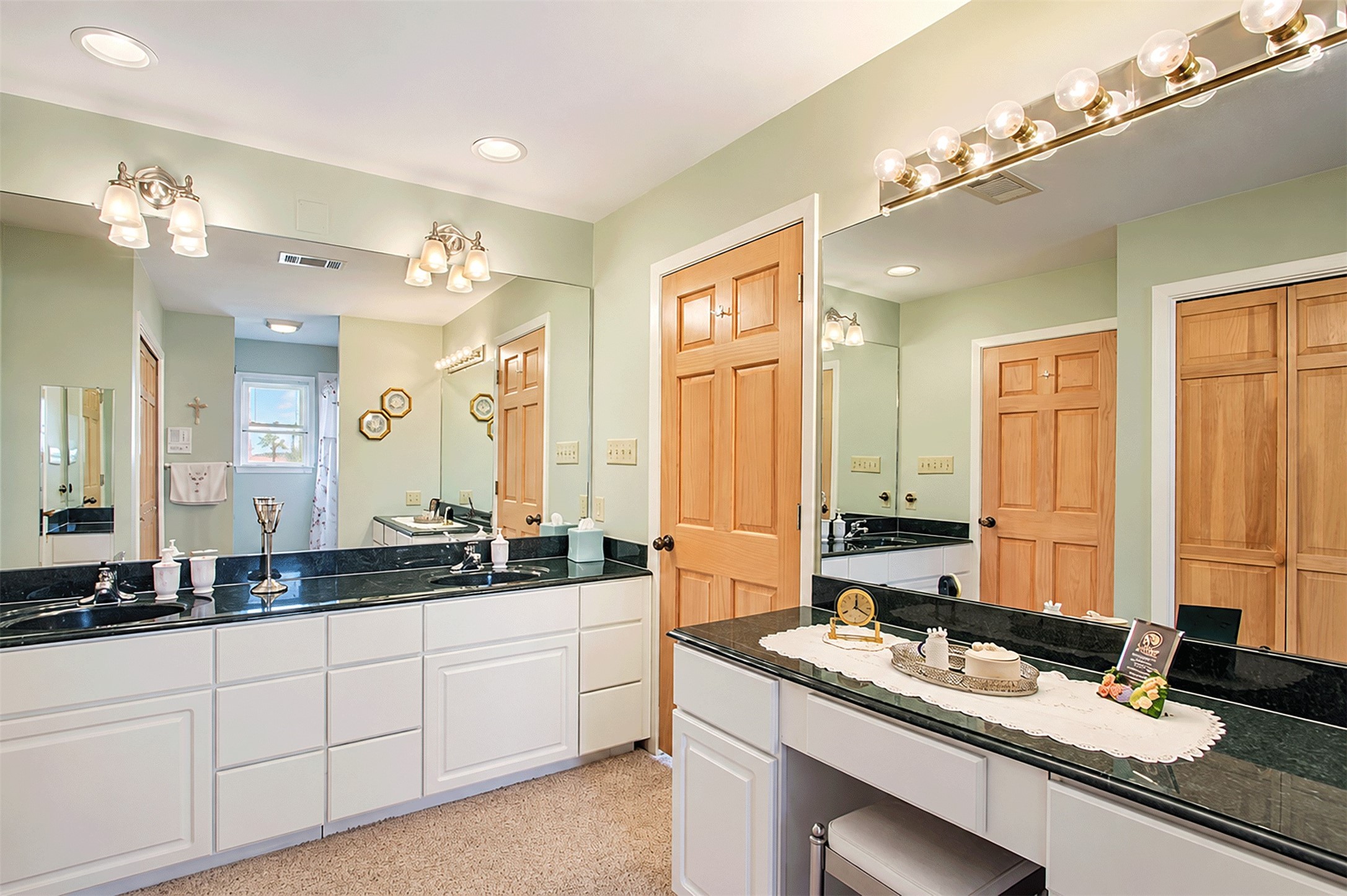 Another view of the large bath upstairs that offers generous counter space and storage on both sides.
