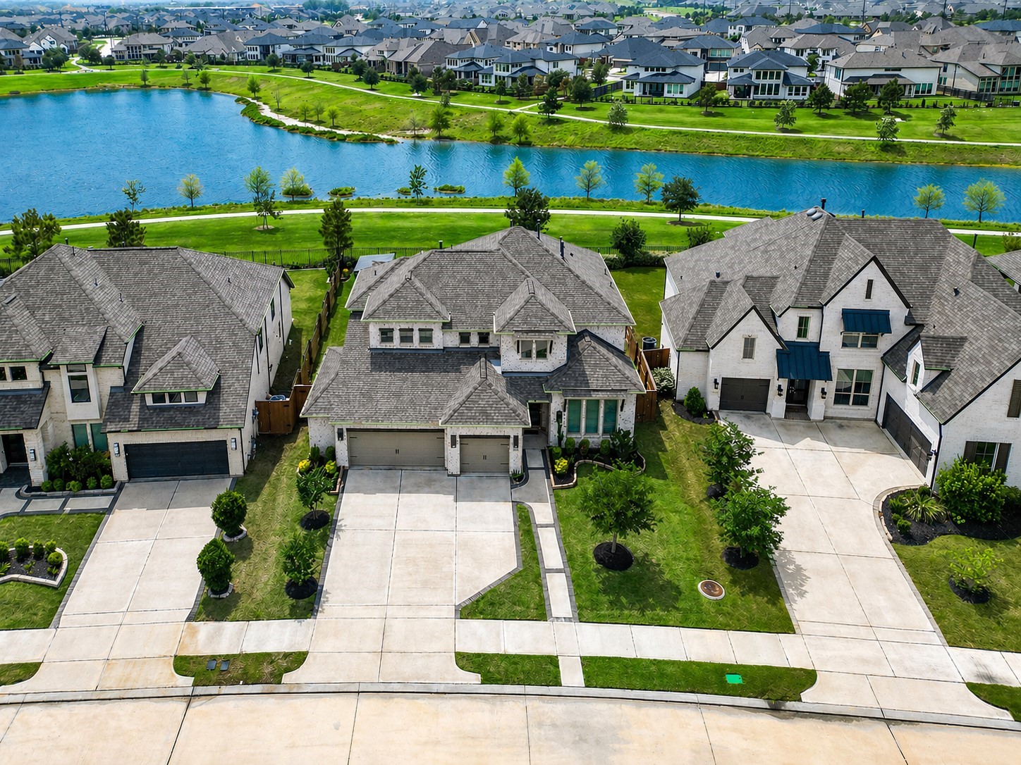 A scenic lake with a walking path enhances the tranquil setting with a resort-style pool.