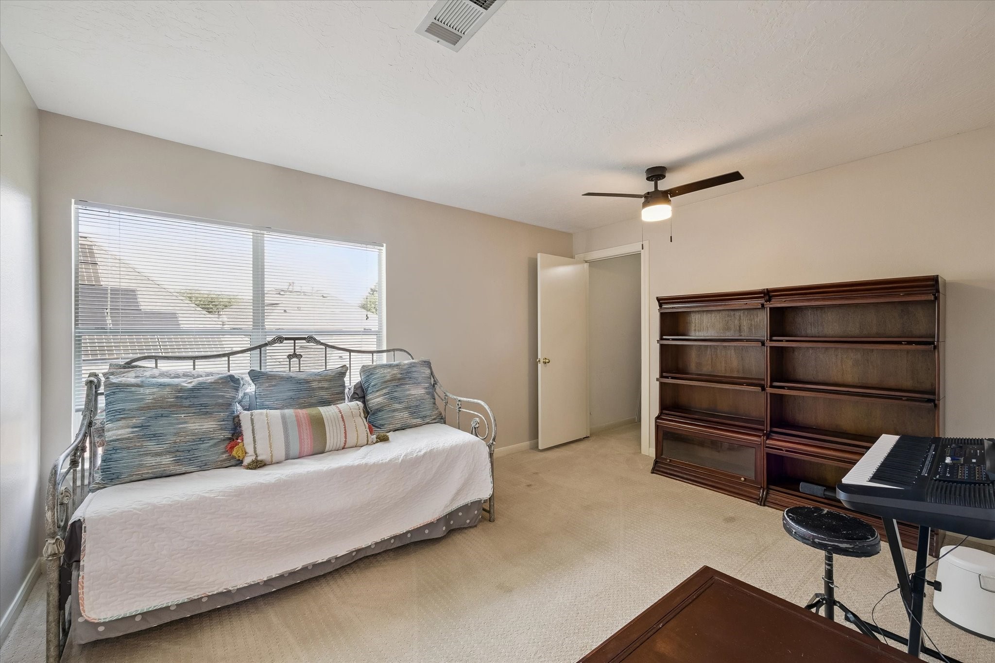 This bedroom has a huge walk in closet and views of the pool