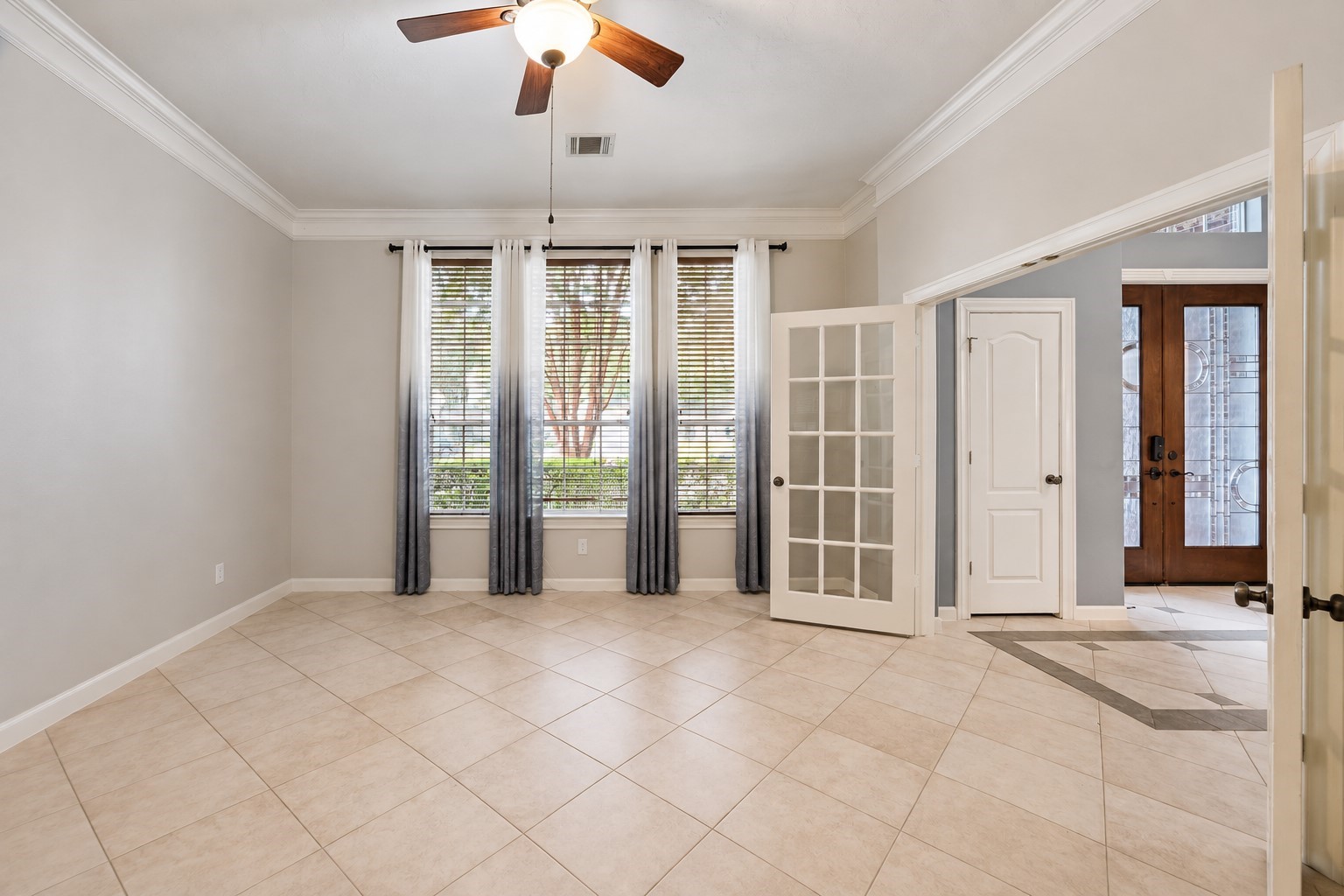 Front study with large storage closet and french doors