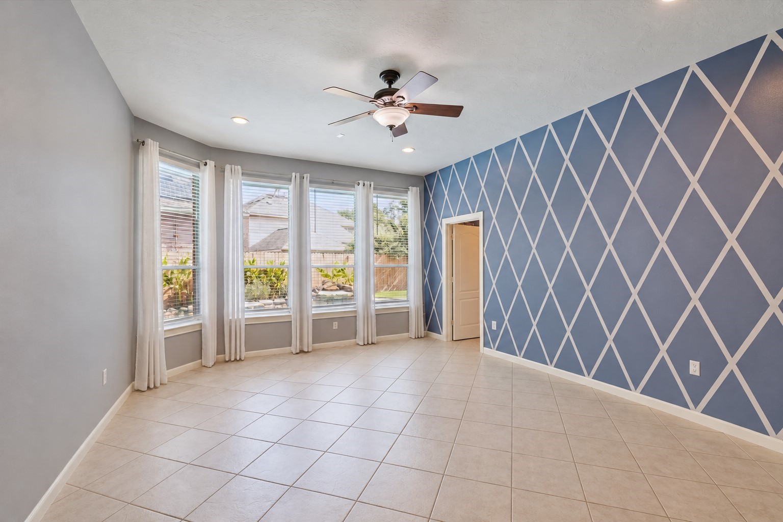 Primary bedroom with views of the pool