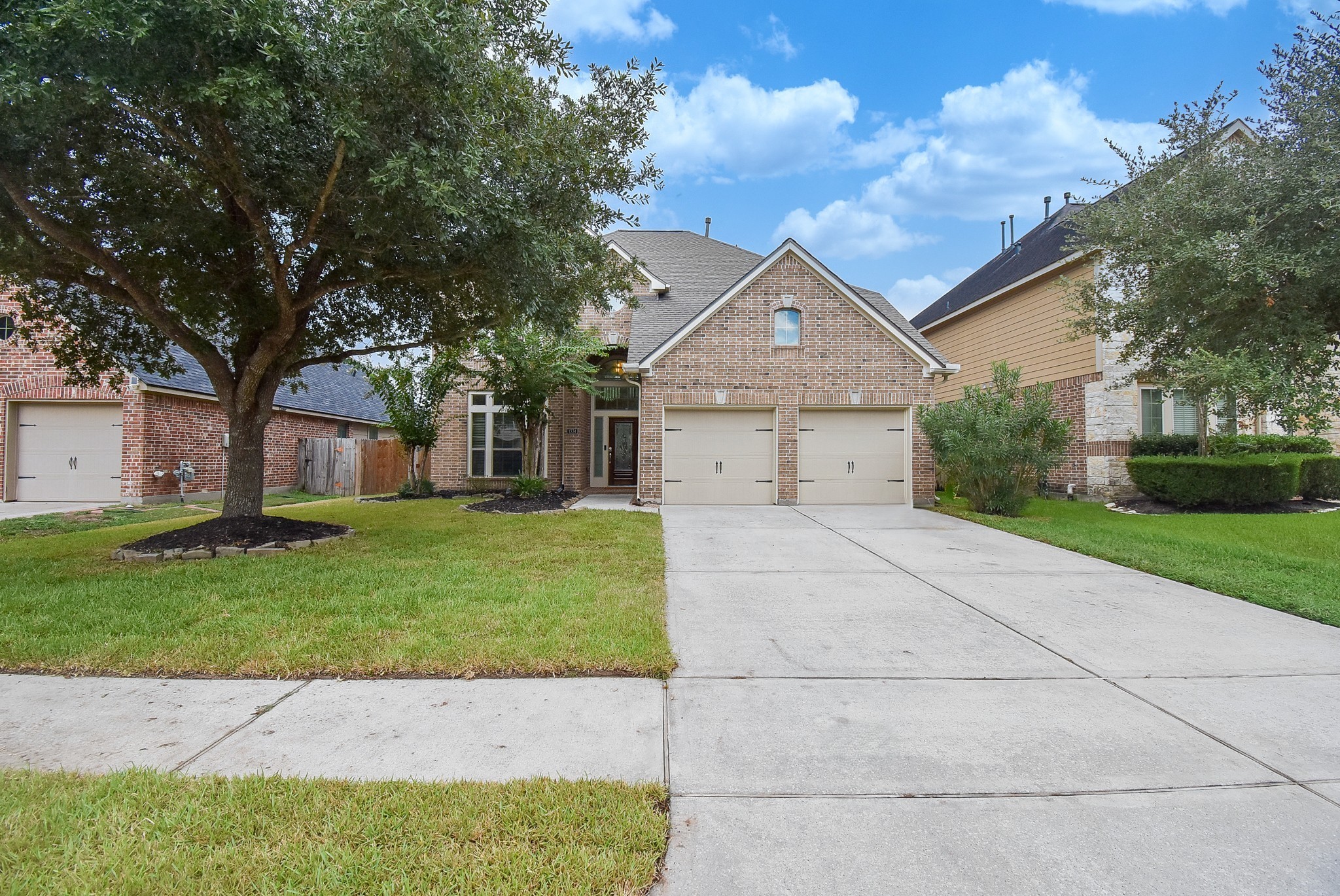 Beautiful curb appeal with fresh sod and mature shade tree!