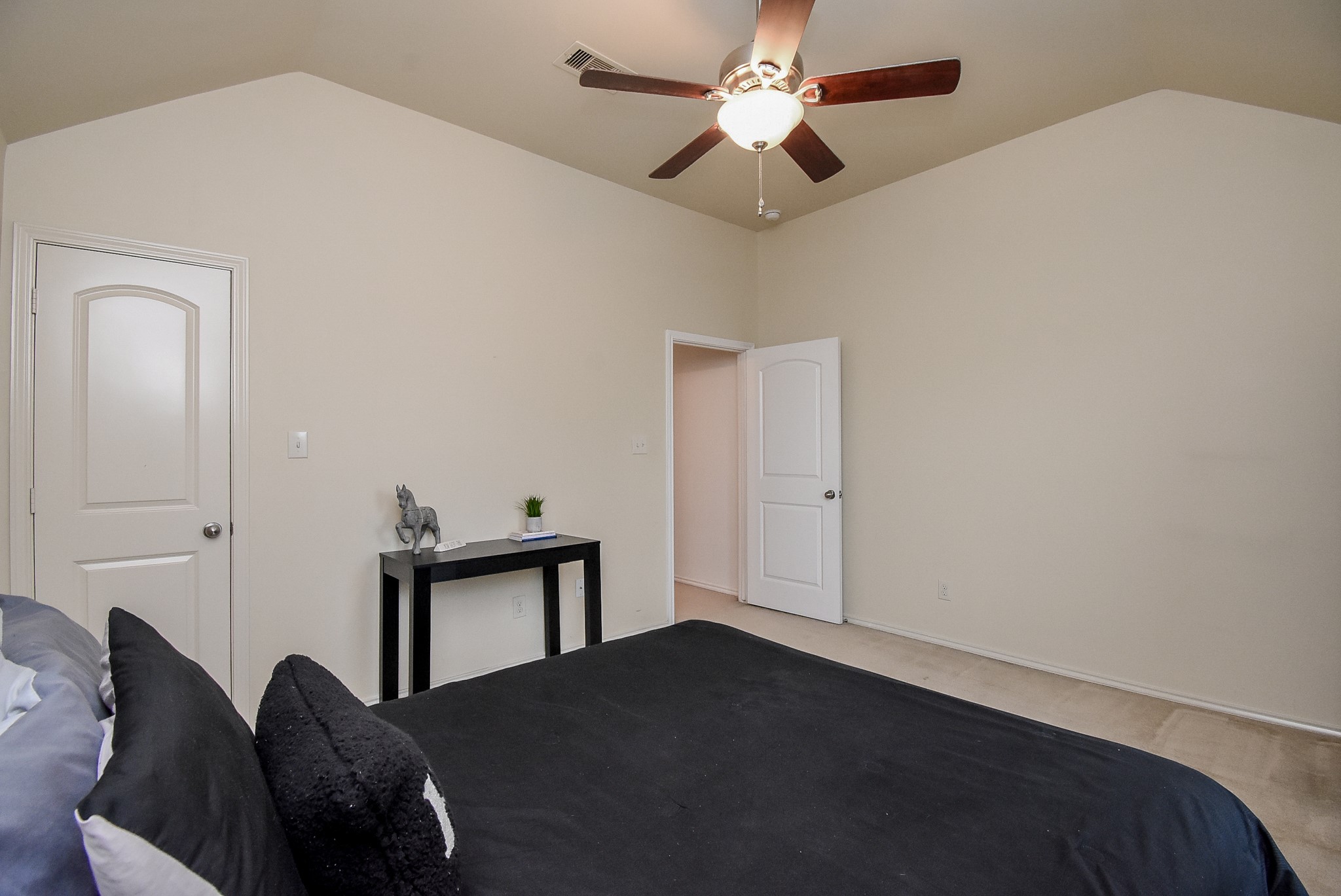 Bedroom 2 has a big walk-in closet and a view of the swimming pool!