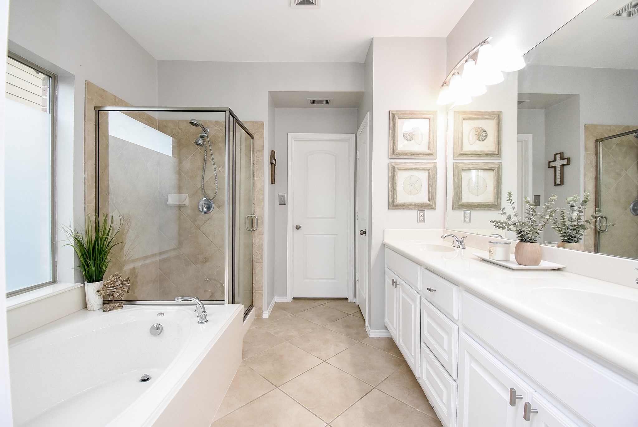 Primary bathroom offers double sinks, cabinet storage and drawers!