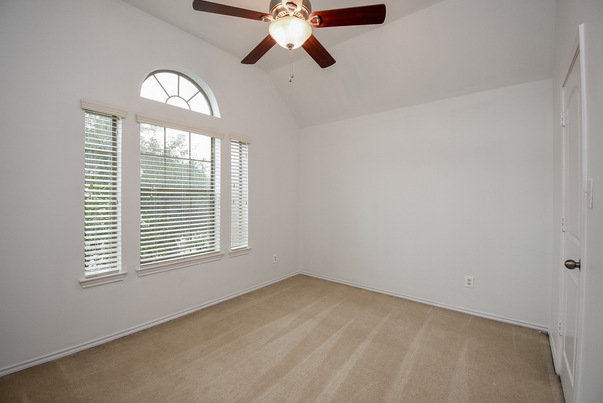 Bedroom four has great views of the mature shade tree in the front yard!