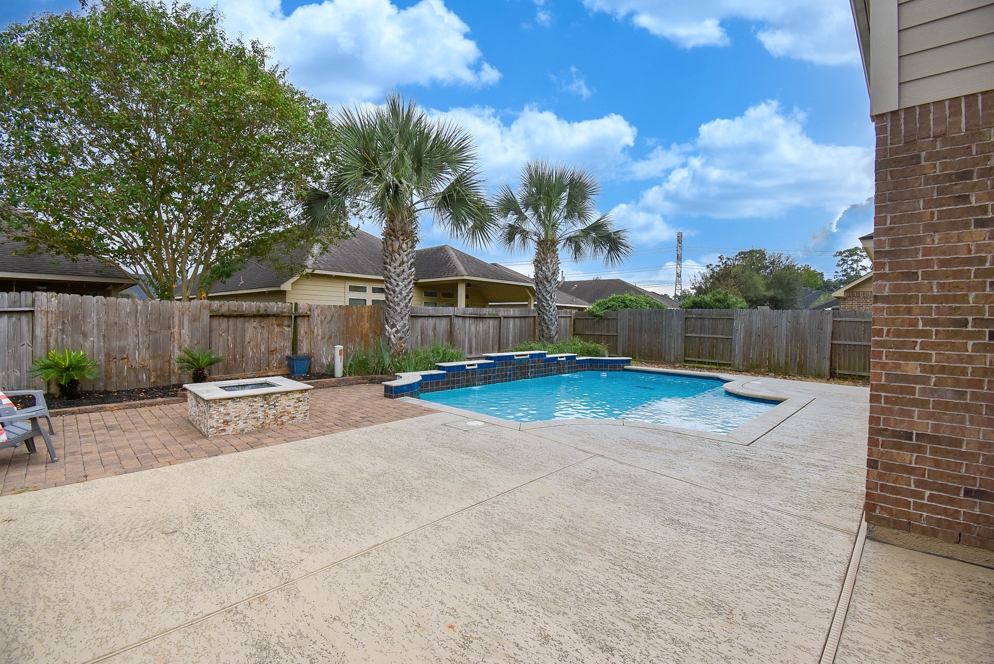 This refreshing pool has water features and sounds that make relaxing sensational.