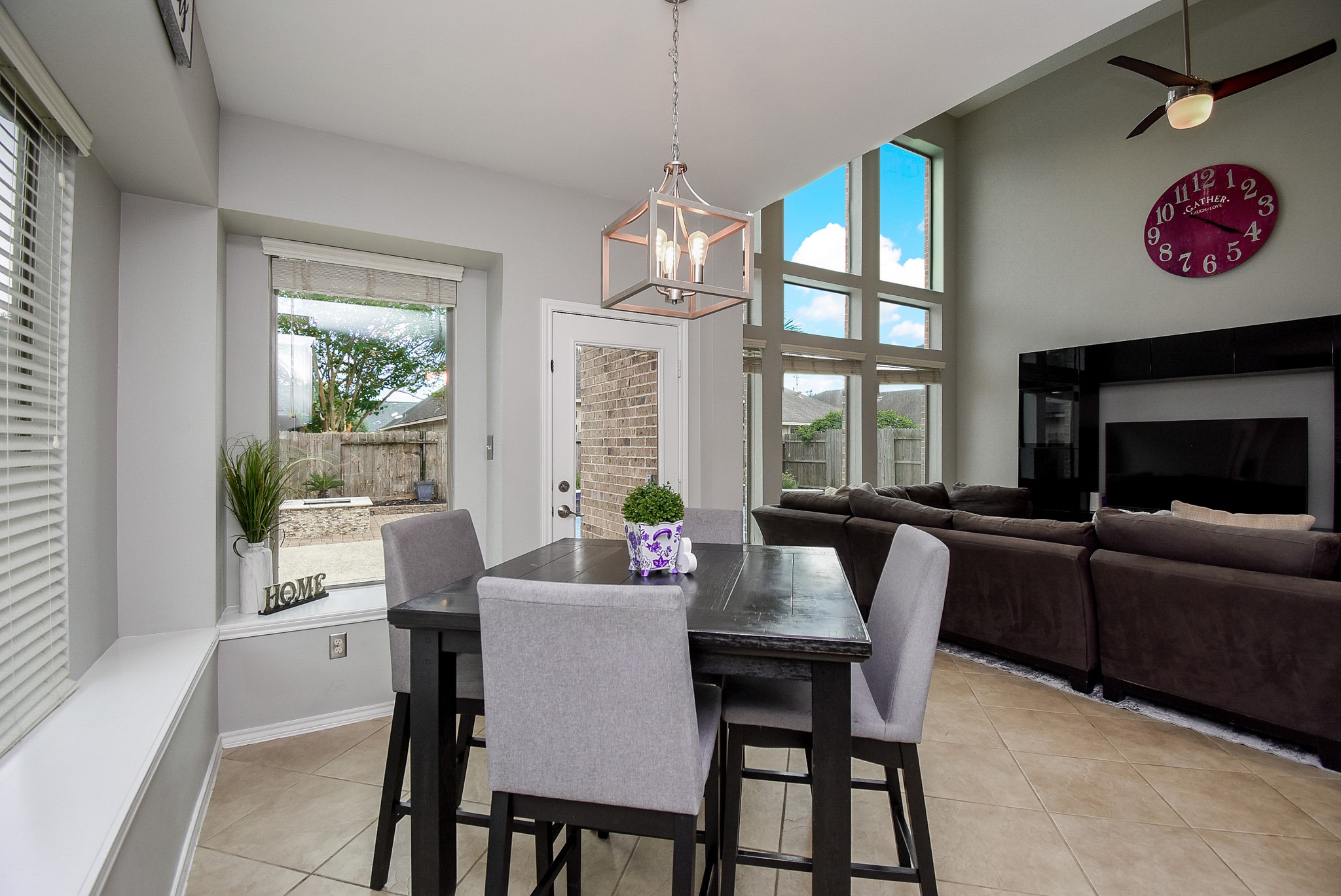 The breakfast area has window seats with large windows.
