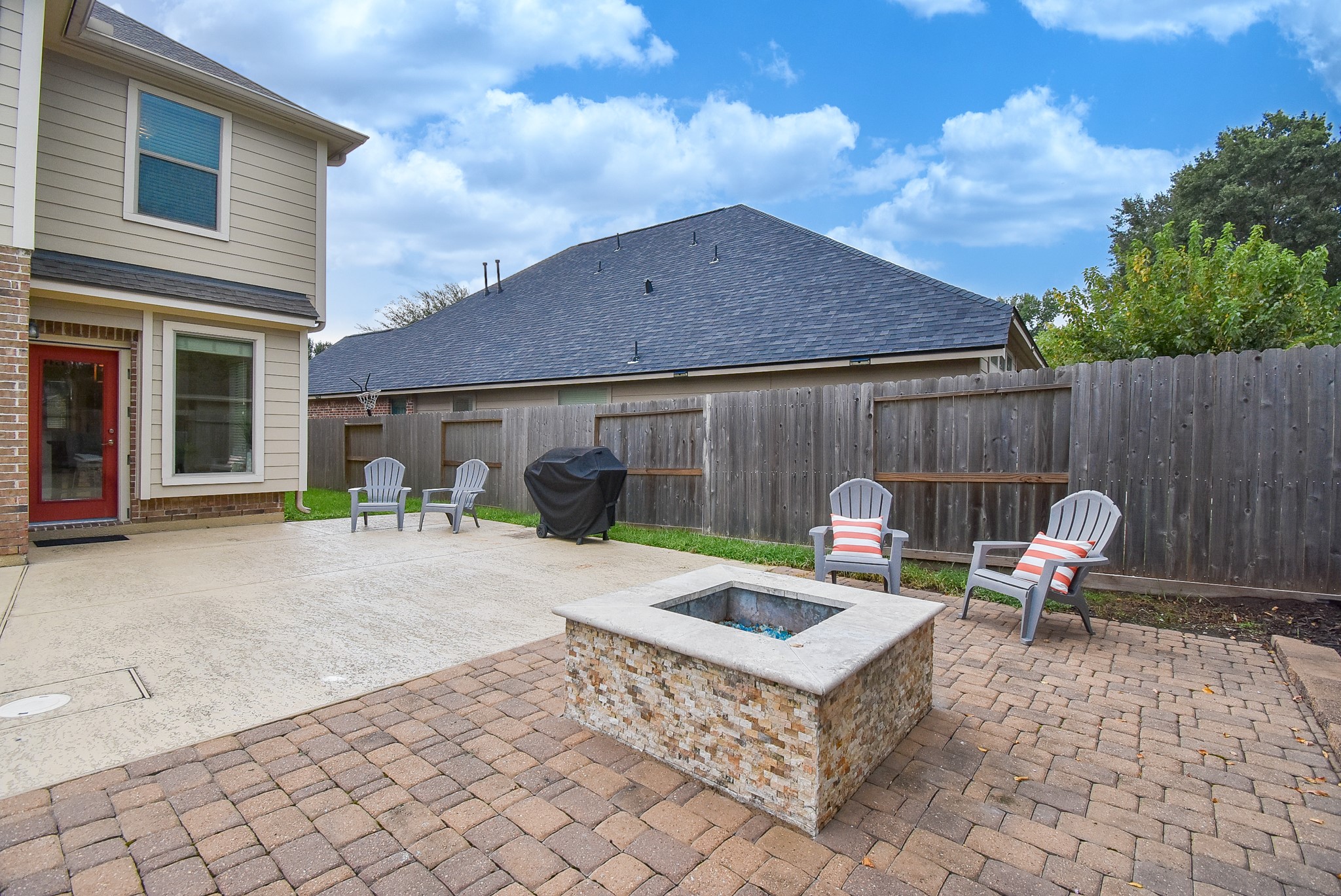 The firepit is surrounded by custom Pavers!