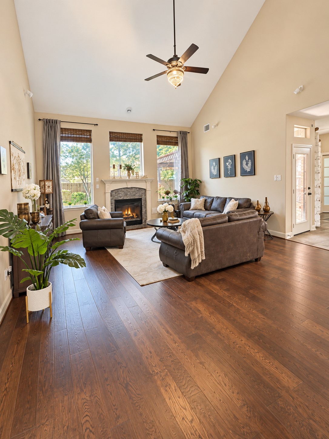Bright and sunny family room with warm wood floors and vaulted ceilings!