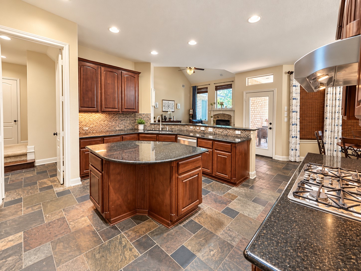 Functional center island provides additional preparation space and enhances the kitchen's inviting layout.