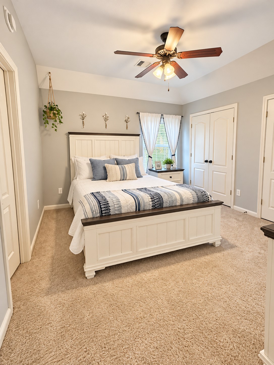 Bright and inviting upstairs 3rd bedroom featuring a vaulted ceiling, soft carpeting, and plenty of natural lighta cozy retreat for rest and relaxation.