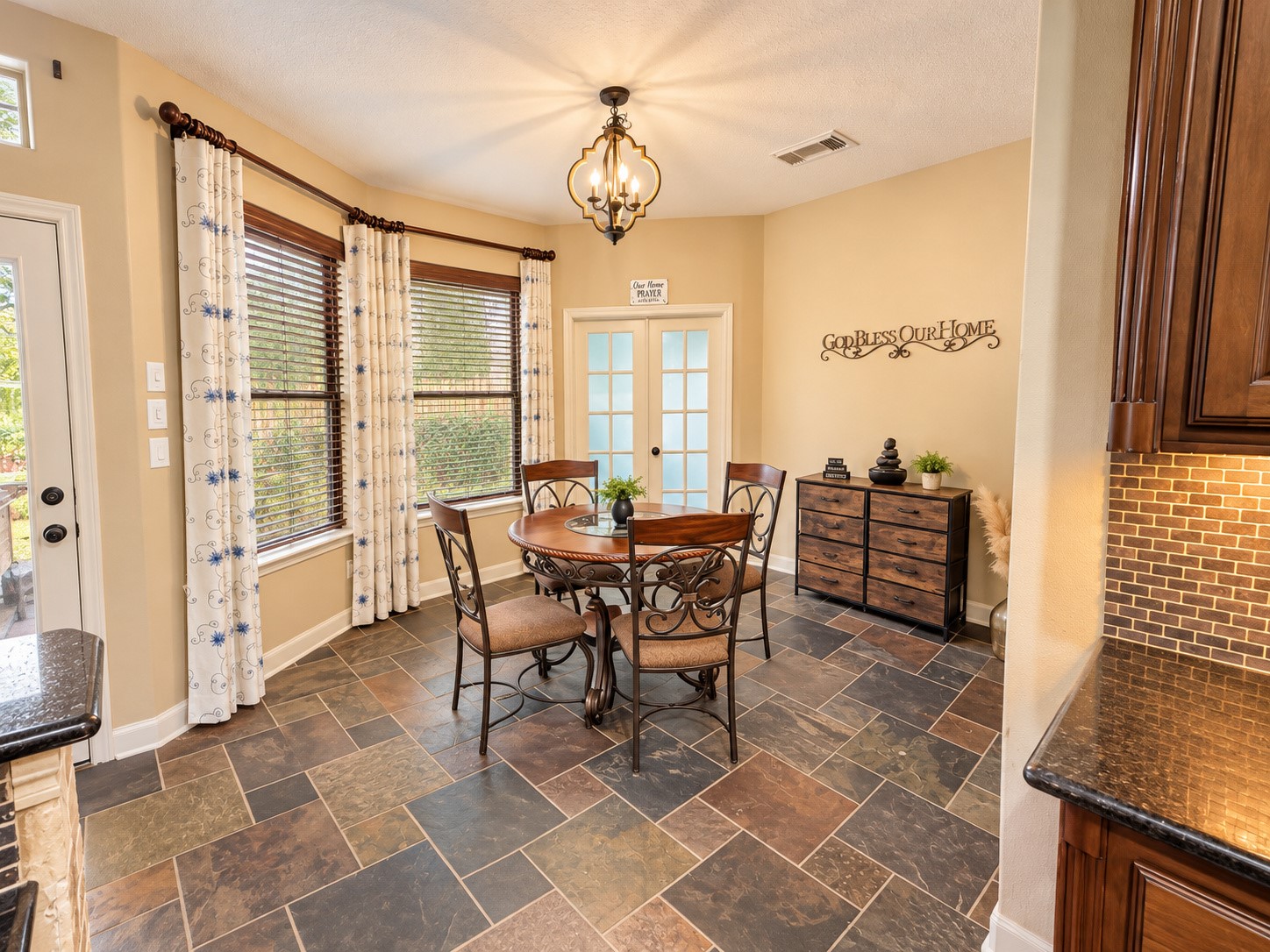 Open kitchen and breakfast area create an inviting space for cooking, dining, and conversation.