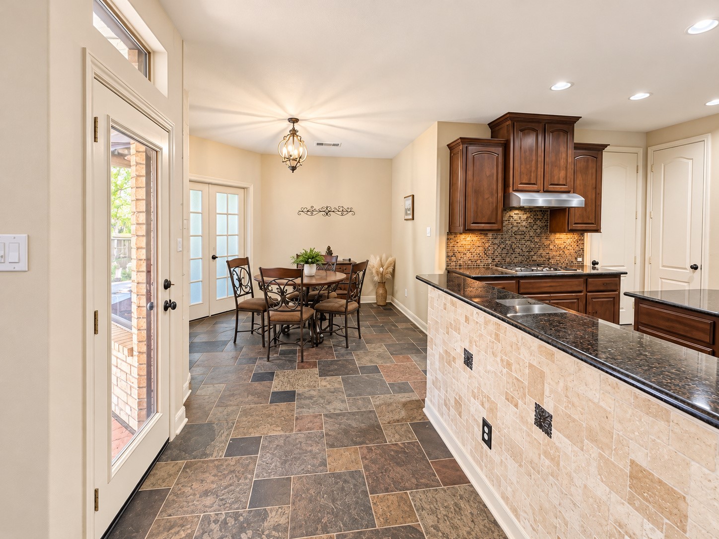 View of the breakfast room near the kitchen from the kitchen bar area.