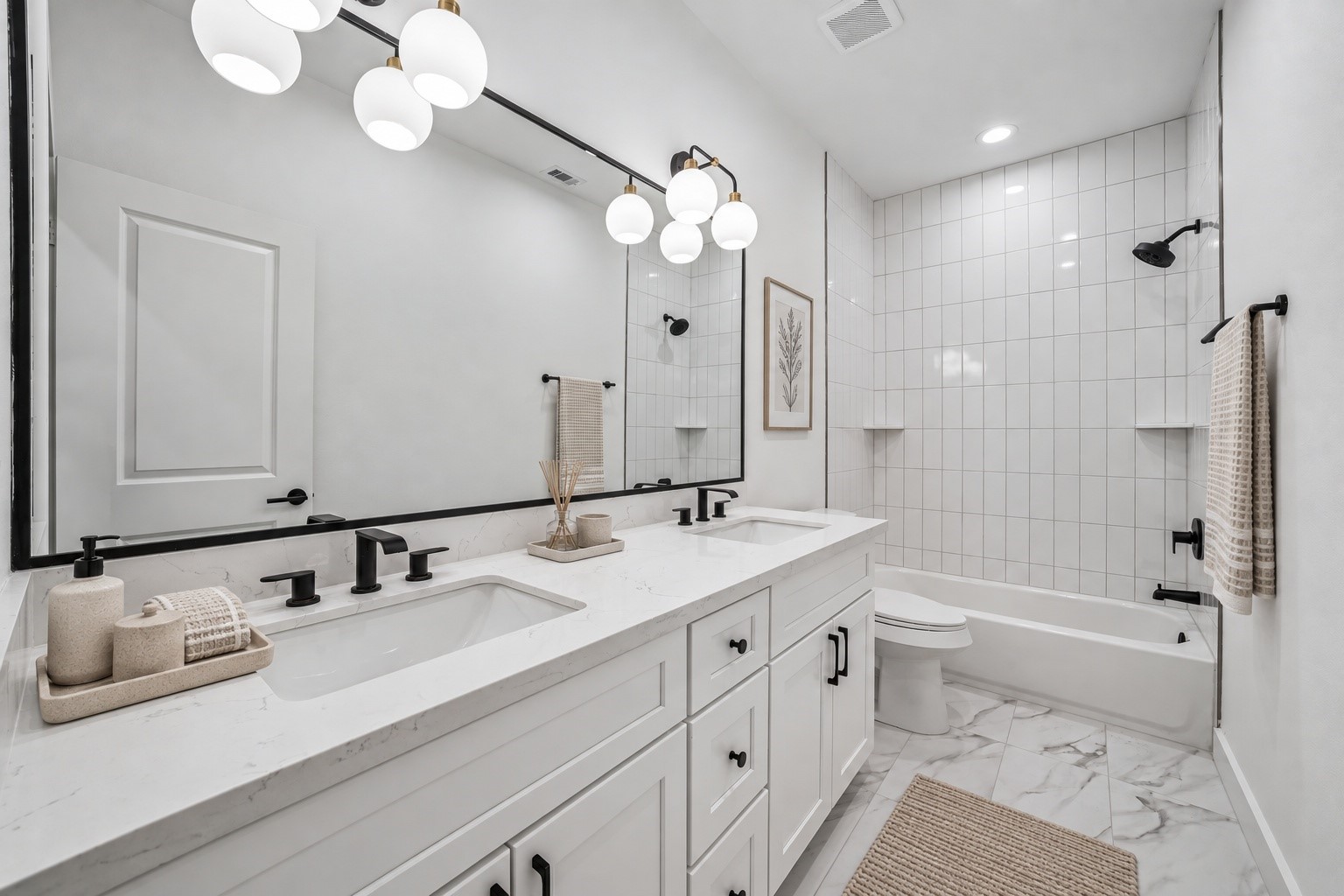 Secondary Bath. Tub & Shower combo with tile surround up to the ceiling. Modern fixtures.