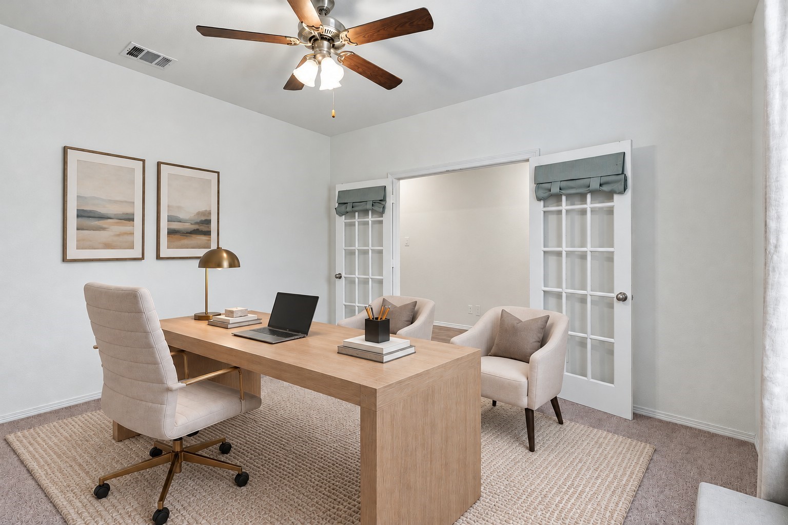 Virtually Staged: This beautifully designed home office offers a bright, sophisticated workspace highlighted by elegant double French doors with glass-paneled inserts.