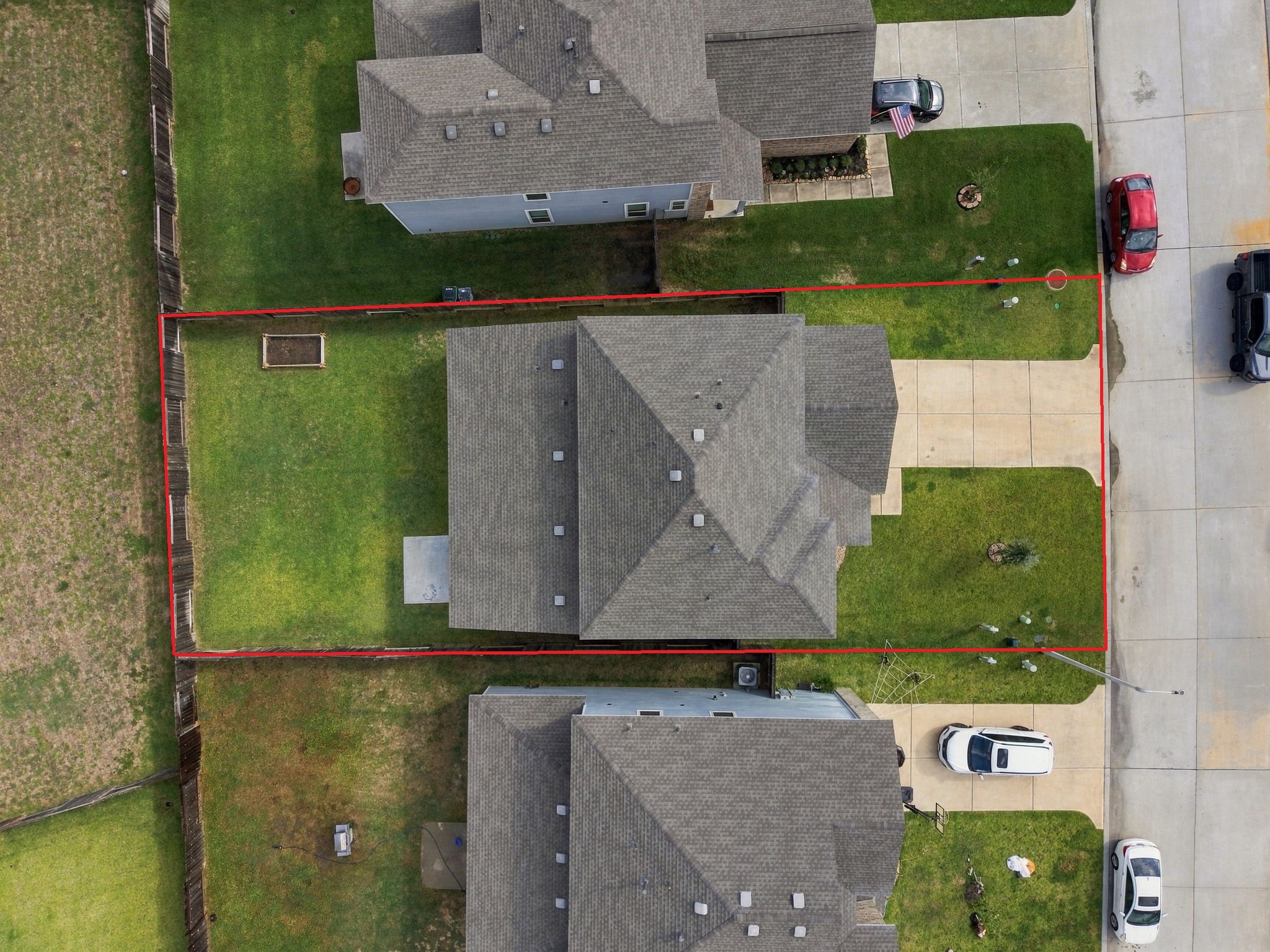 This aerial view showcases a beautiful home situated on a 6,464-square-foot lot, offering a spacious backyard and a well-defined property layout.