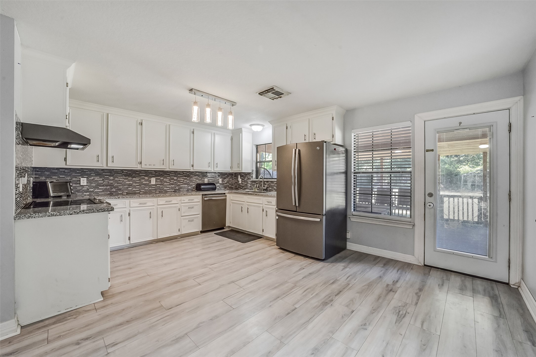 Generous counter space and ample storage provide everyday convenience. Refrigerator is included.