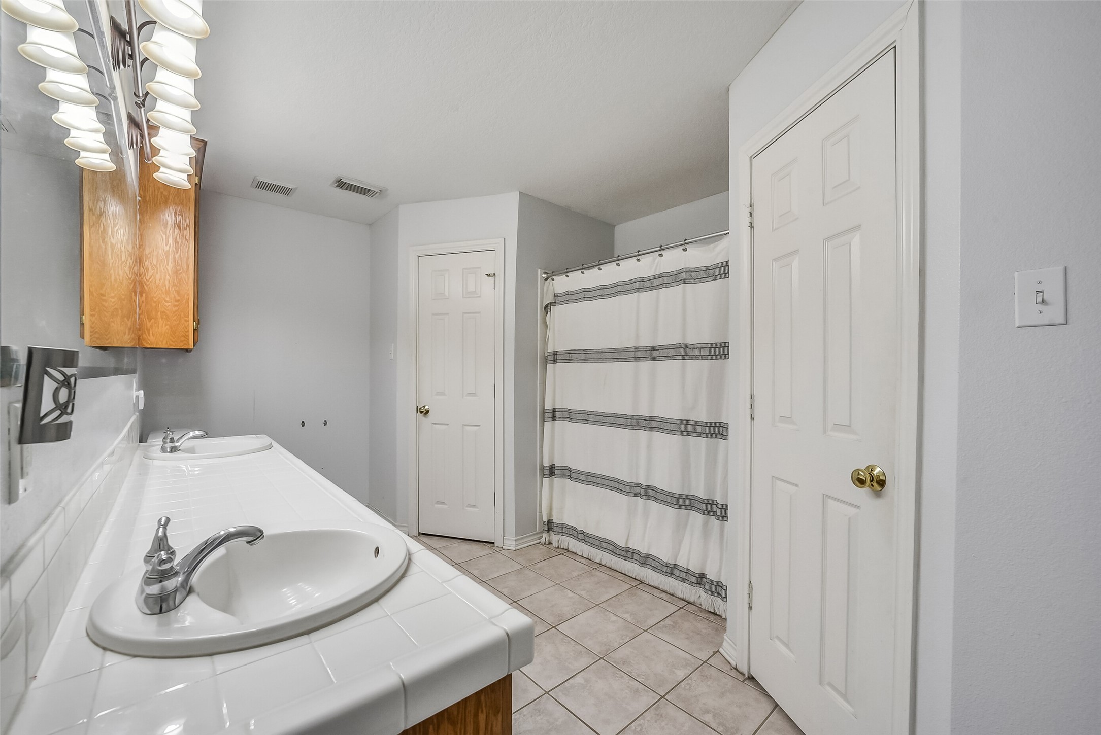 Primary bathroom with his and her sink.