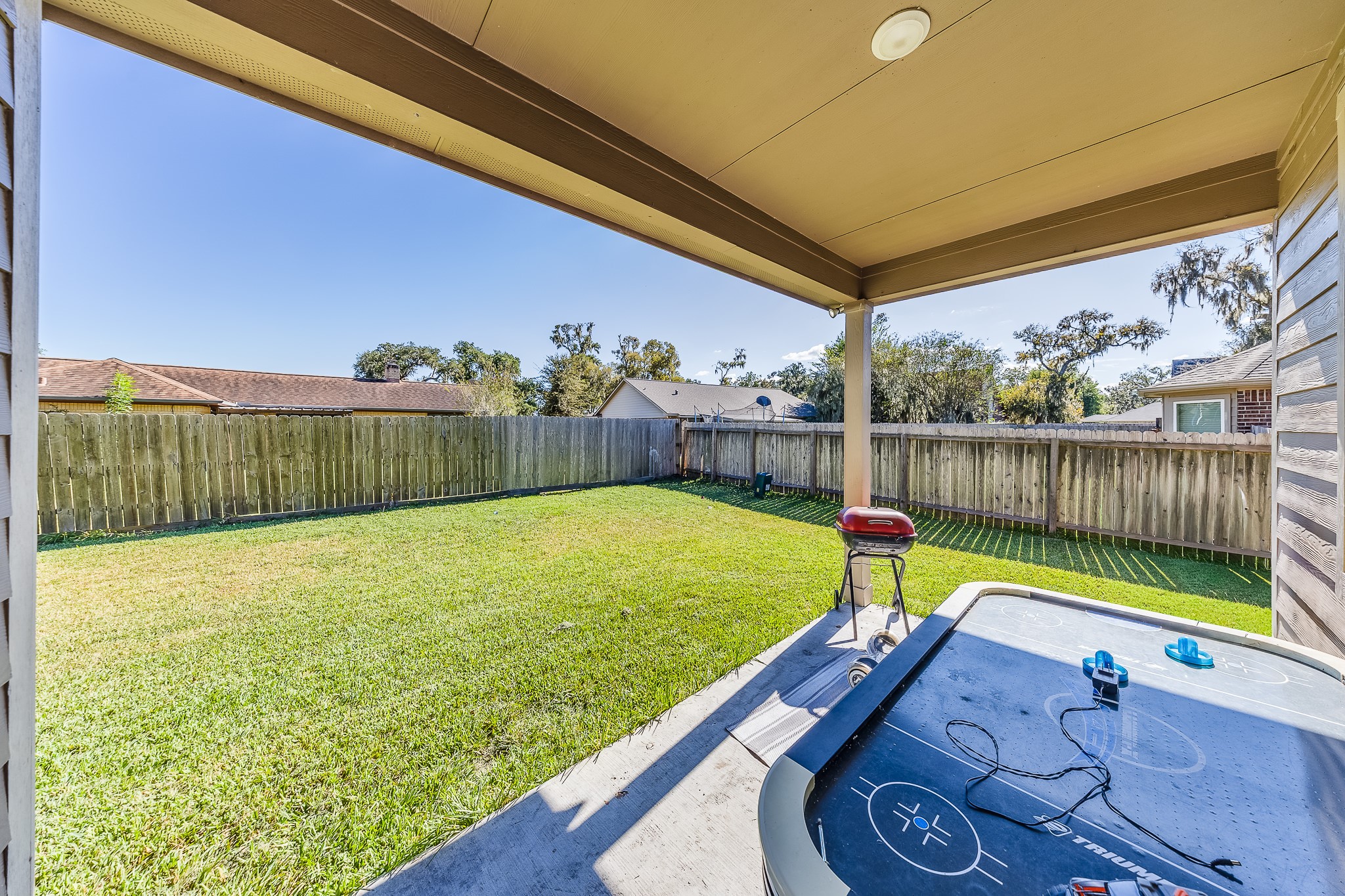 Sip your morning coffee in the shade while overlooking your backyard.