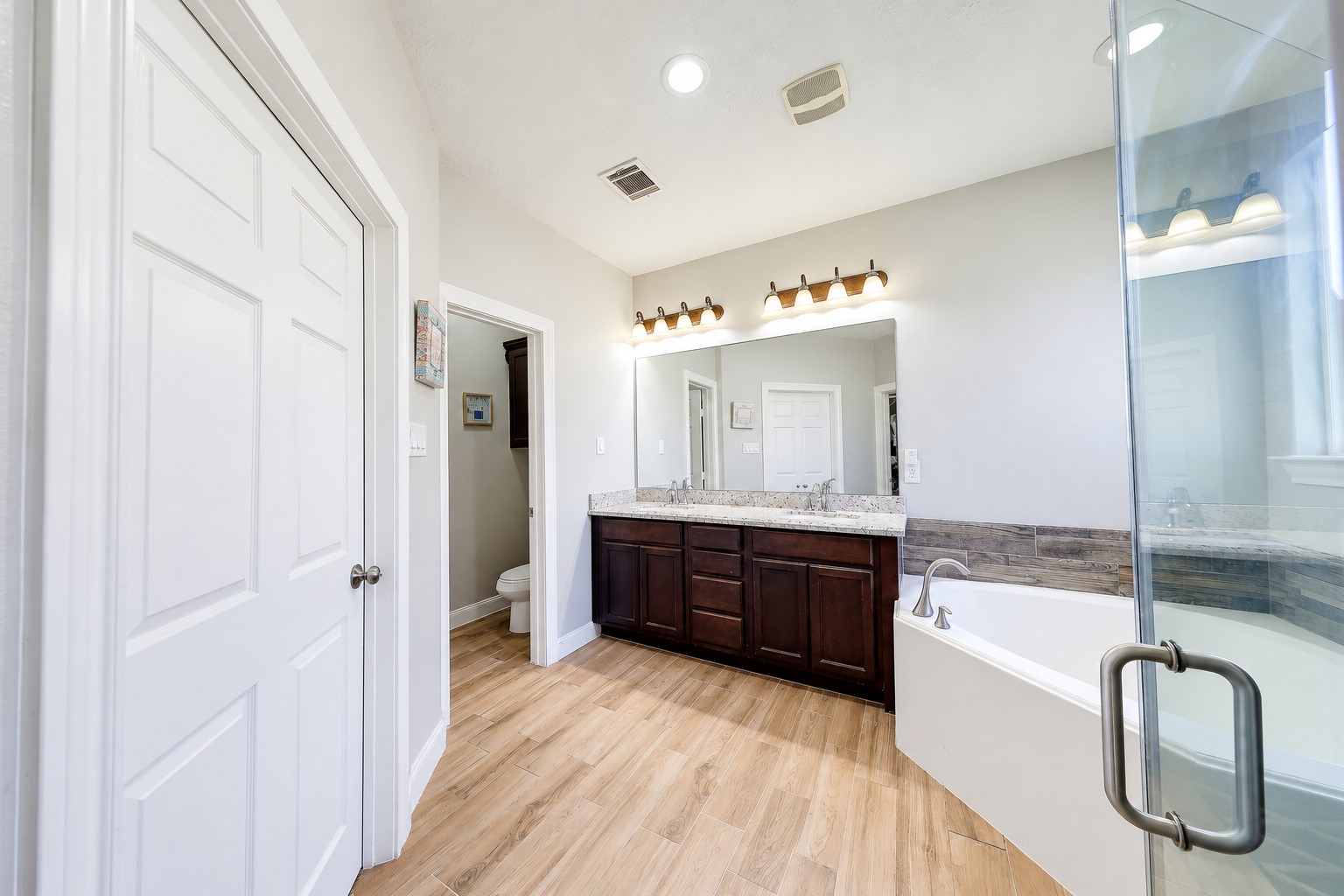 Start your mornings with the convenience of a spacious double vanity.