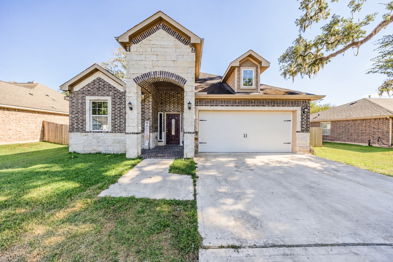 A grand brick-and-stone entrance makes every arrival feel special.