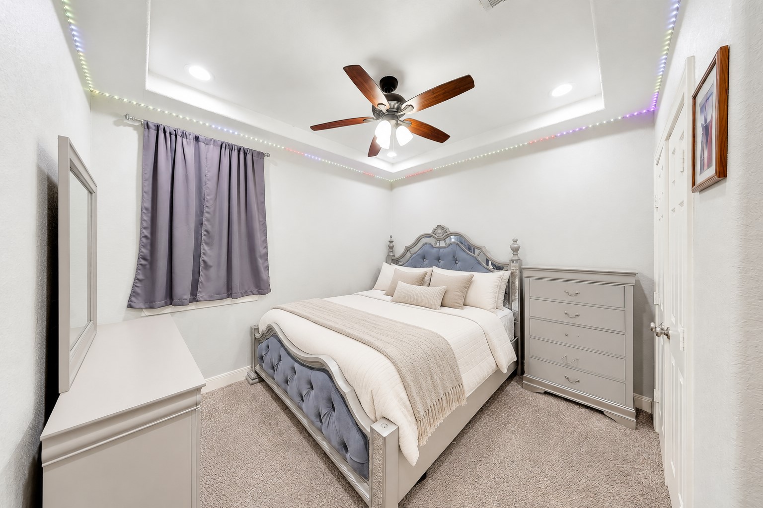 Settle into another inviting bedroom with space to rest and recharge.