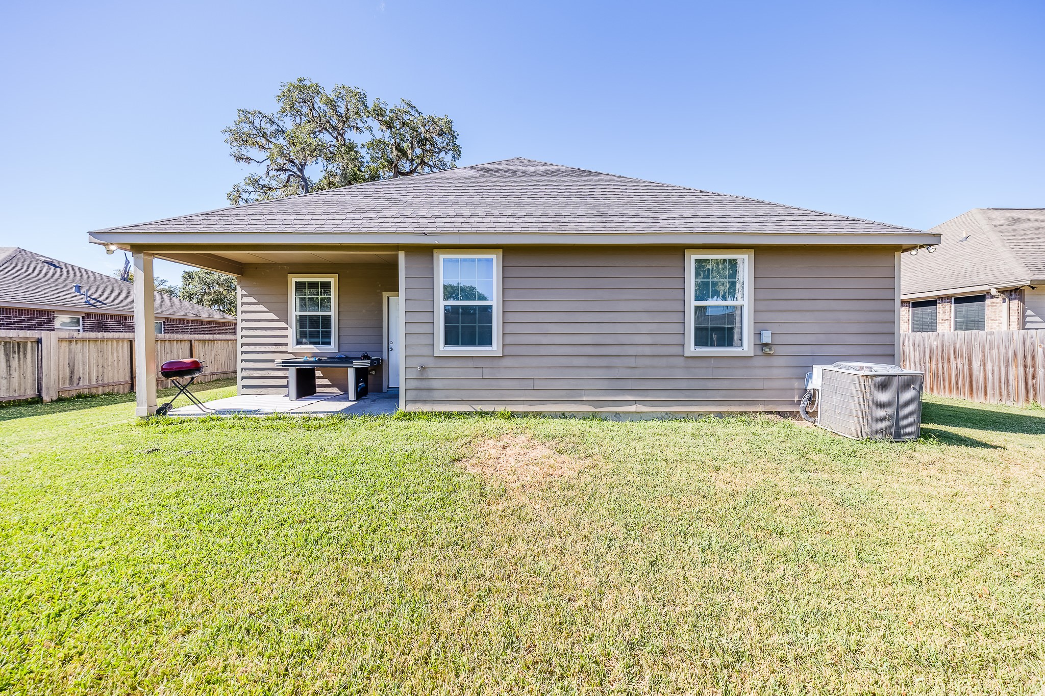 Bring your ideas for gardening, gatherings, and outdoor play to this roomy fenced yard.