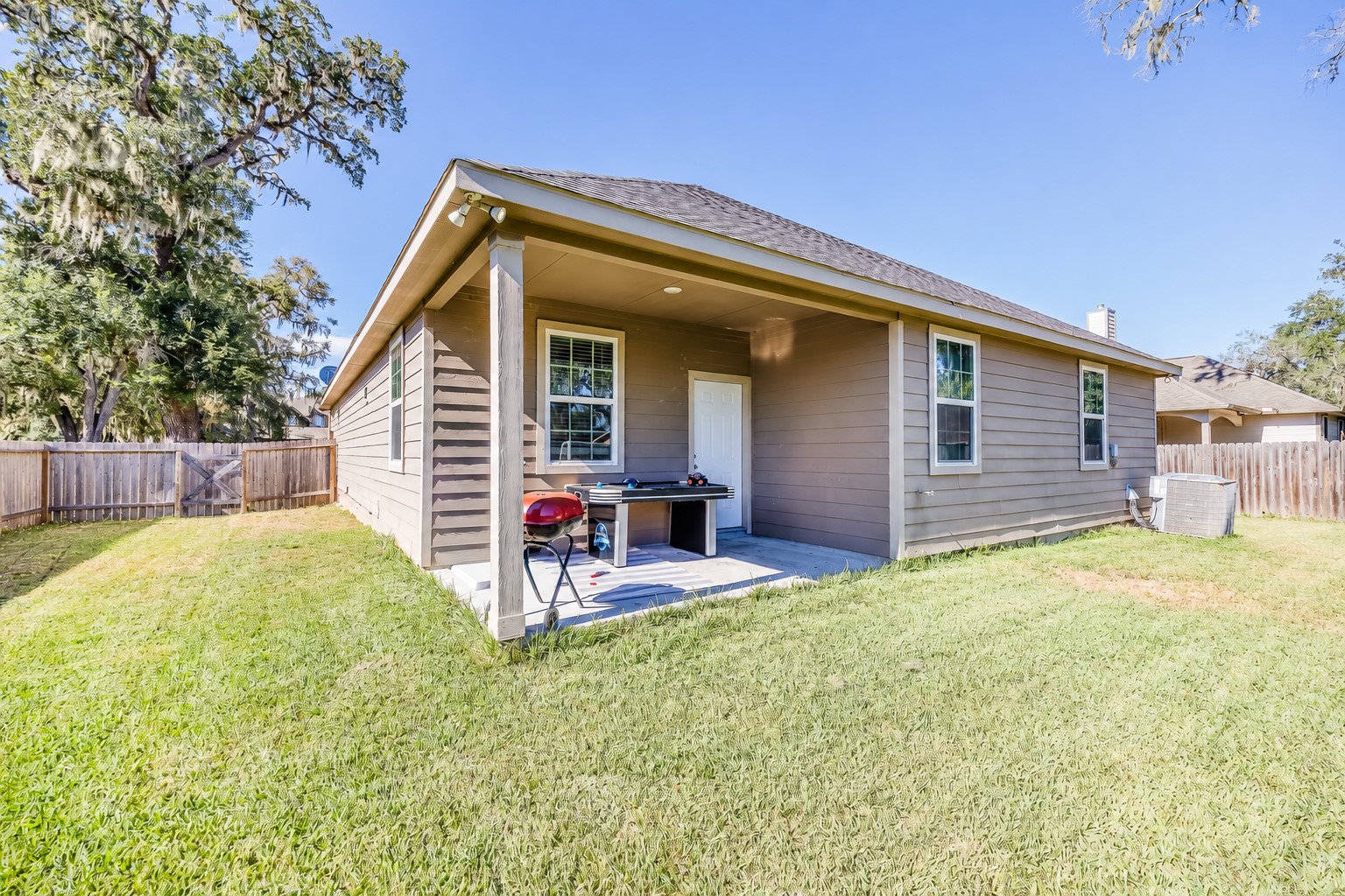 Keep the grill close and enjoy relaxed weekends beneath your covered patio.