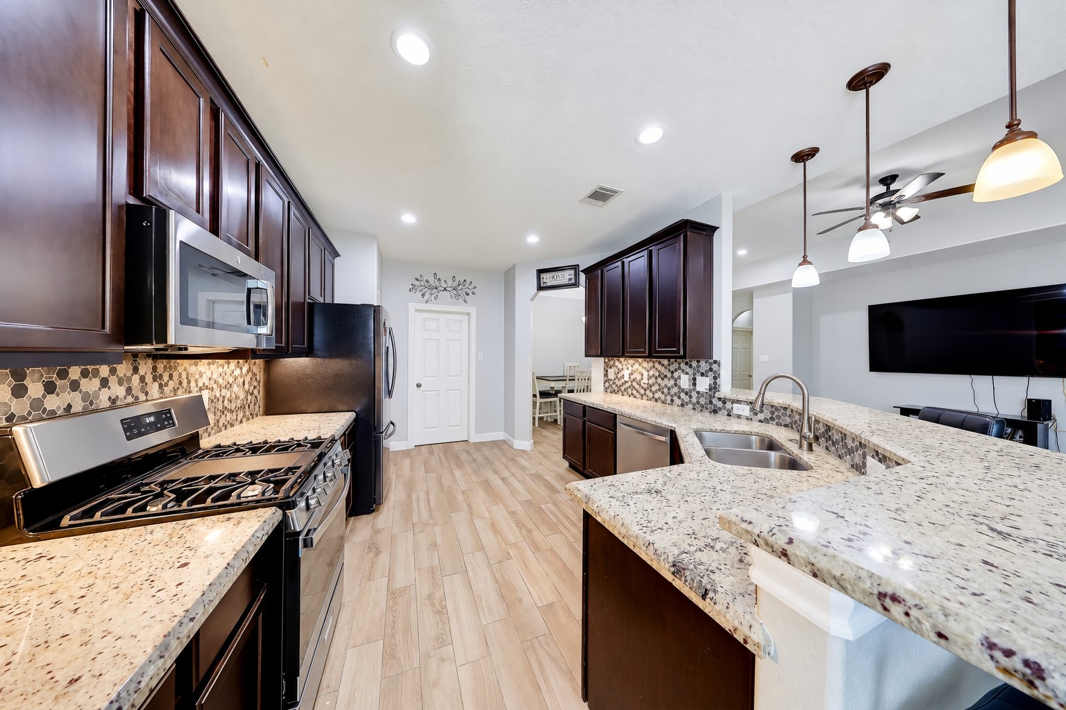 Prepare favorite recipes while guests pull up a seat at the breakfast bar.