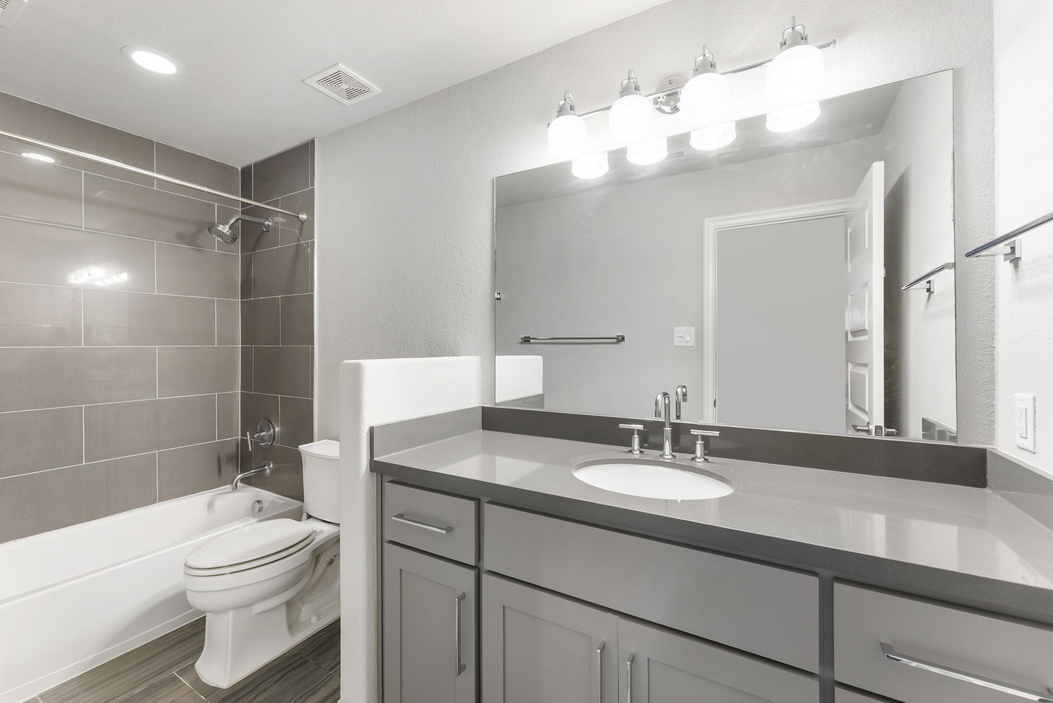 Two secondary bedrooms share this secondary bathroom.