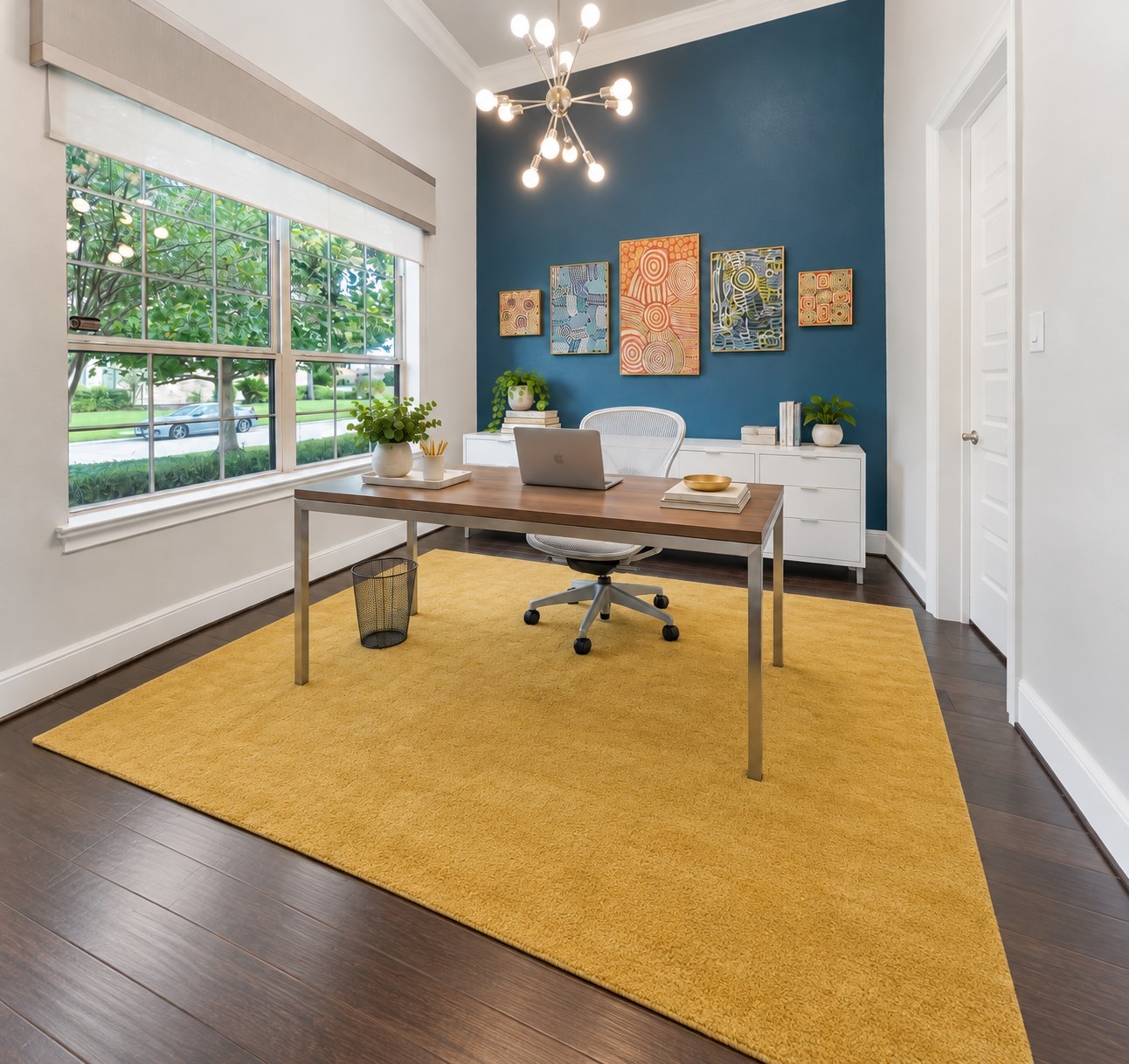 Versatile home office space with large windows. Great for remote work! (Furniture has been virtually staged)