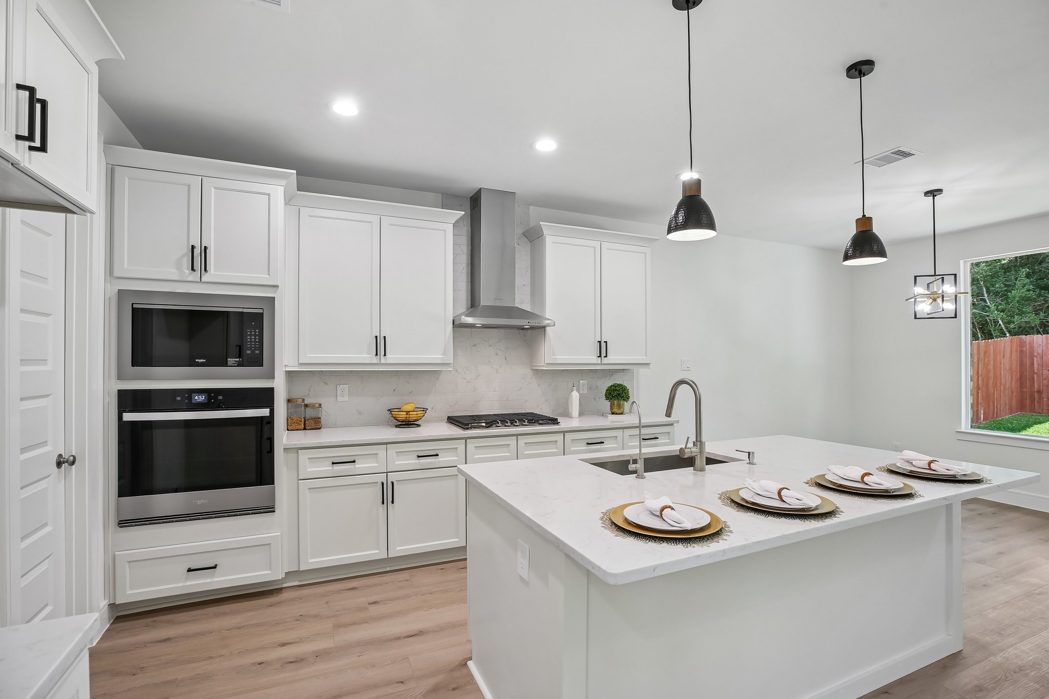 Spacious kitchen w/oversized island w/gleaming quartz countertops