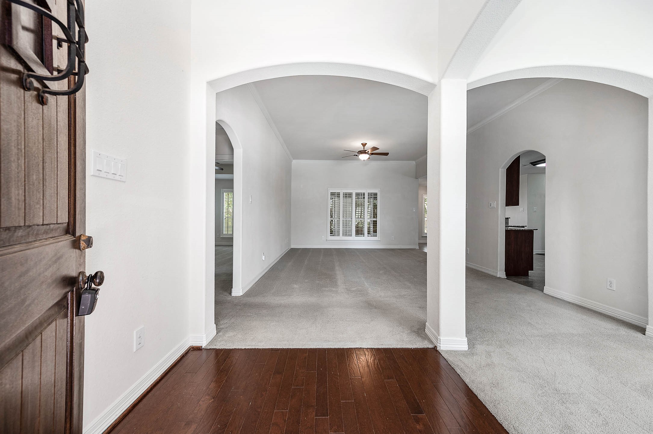 Step through the inviting front door into a spacious family room seamlessly connected to elegant formal dining areas. Step through the inviting front door into a spacious family room seamlessly connected to elegant formal dining areas.