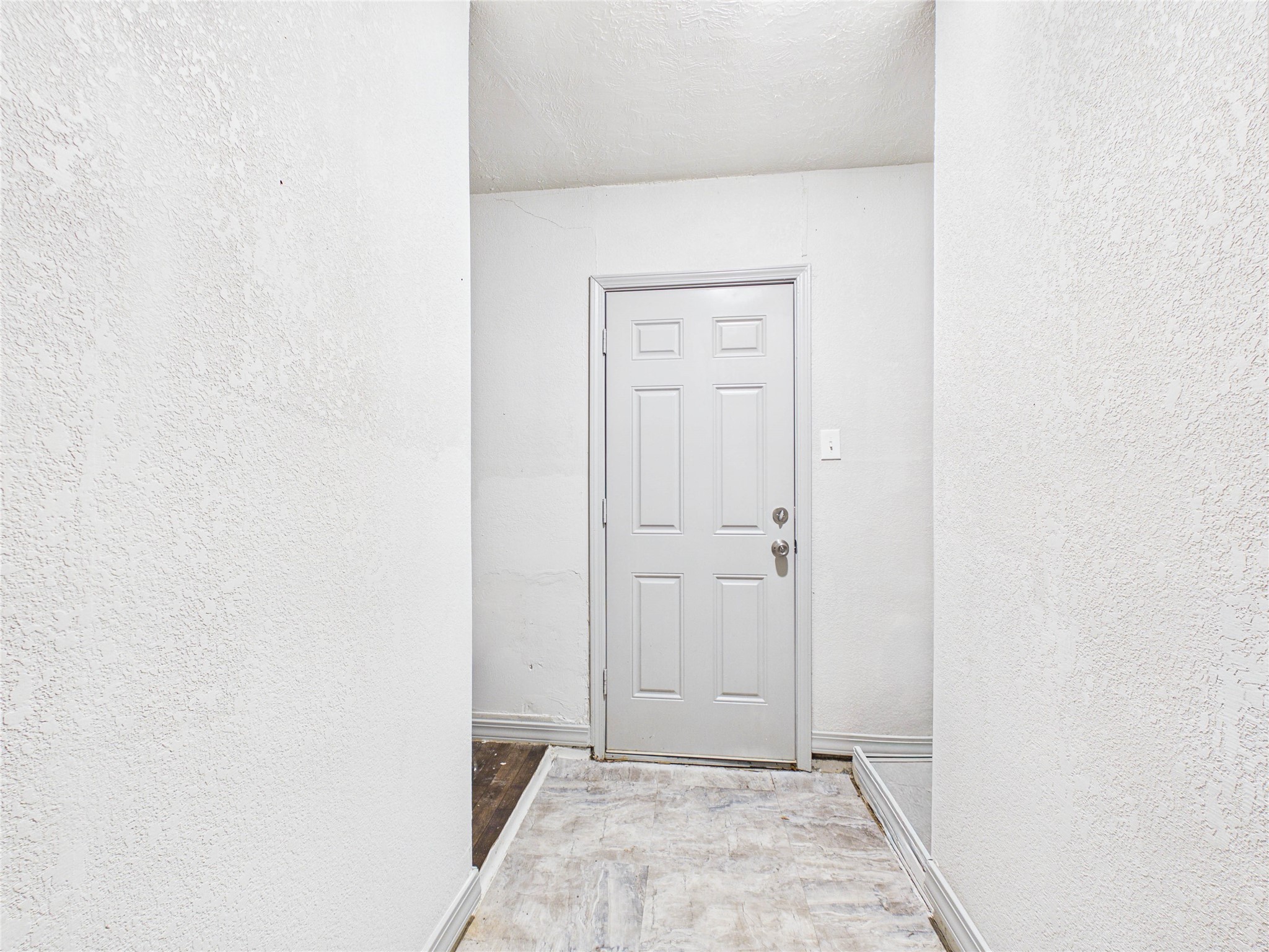 This door leads to the side of the house that has the laundry room