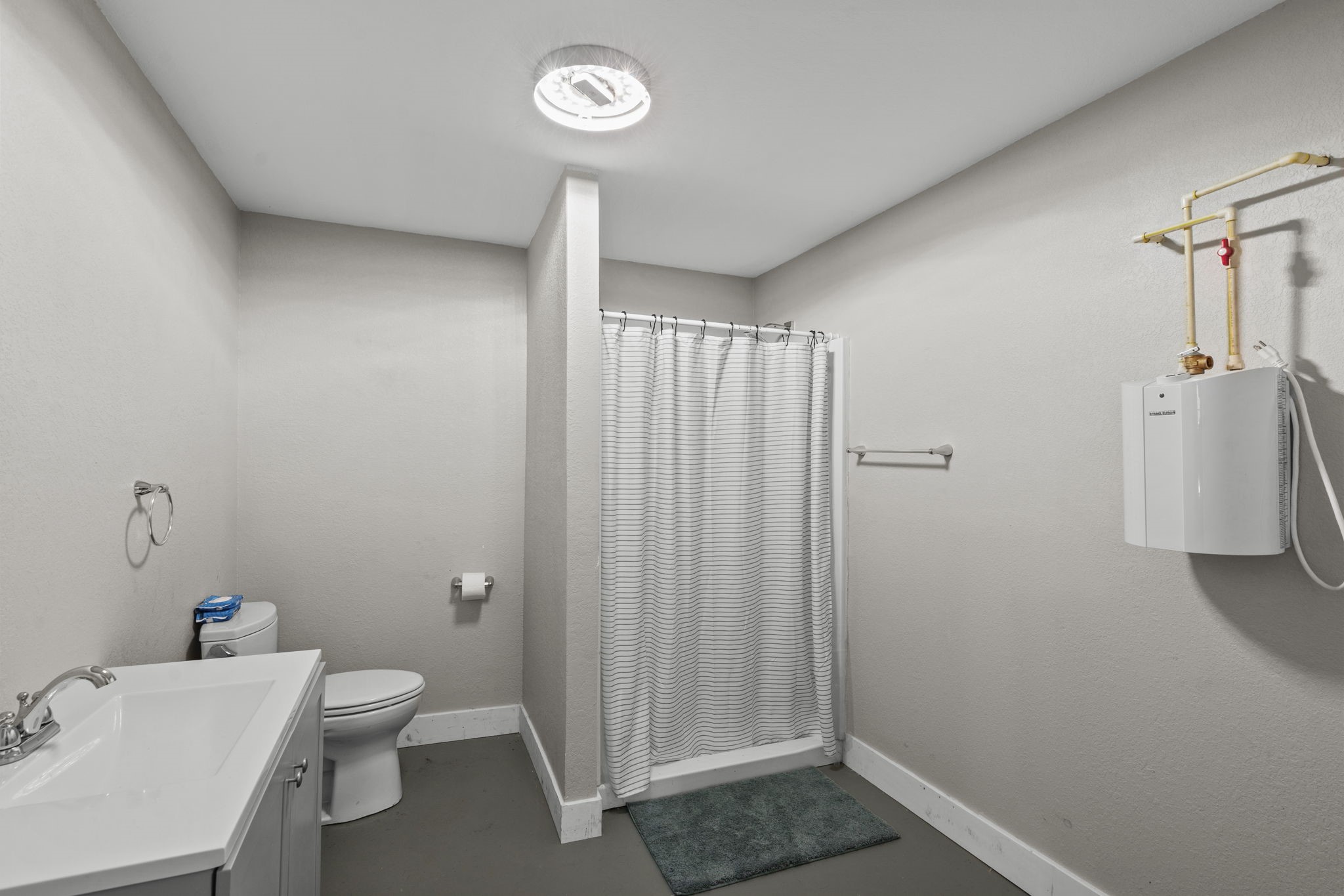 Full bathroom in office area.