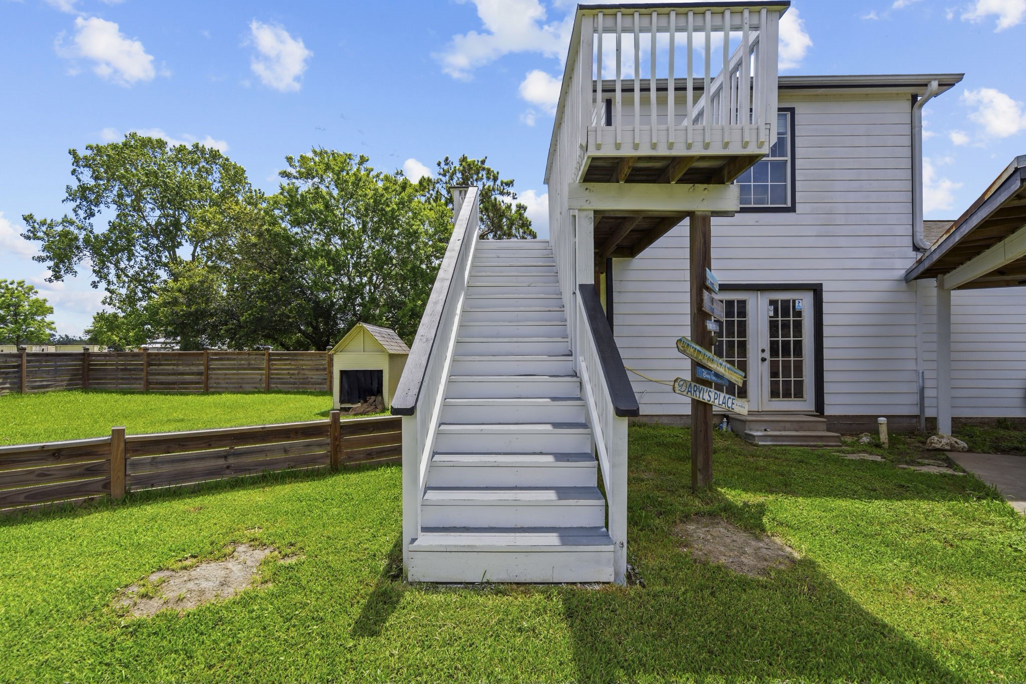 Stairs and deck to gameroom. French doors below are to the office and full bathroom.