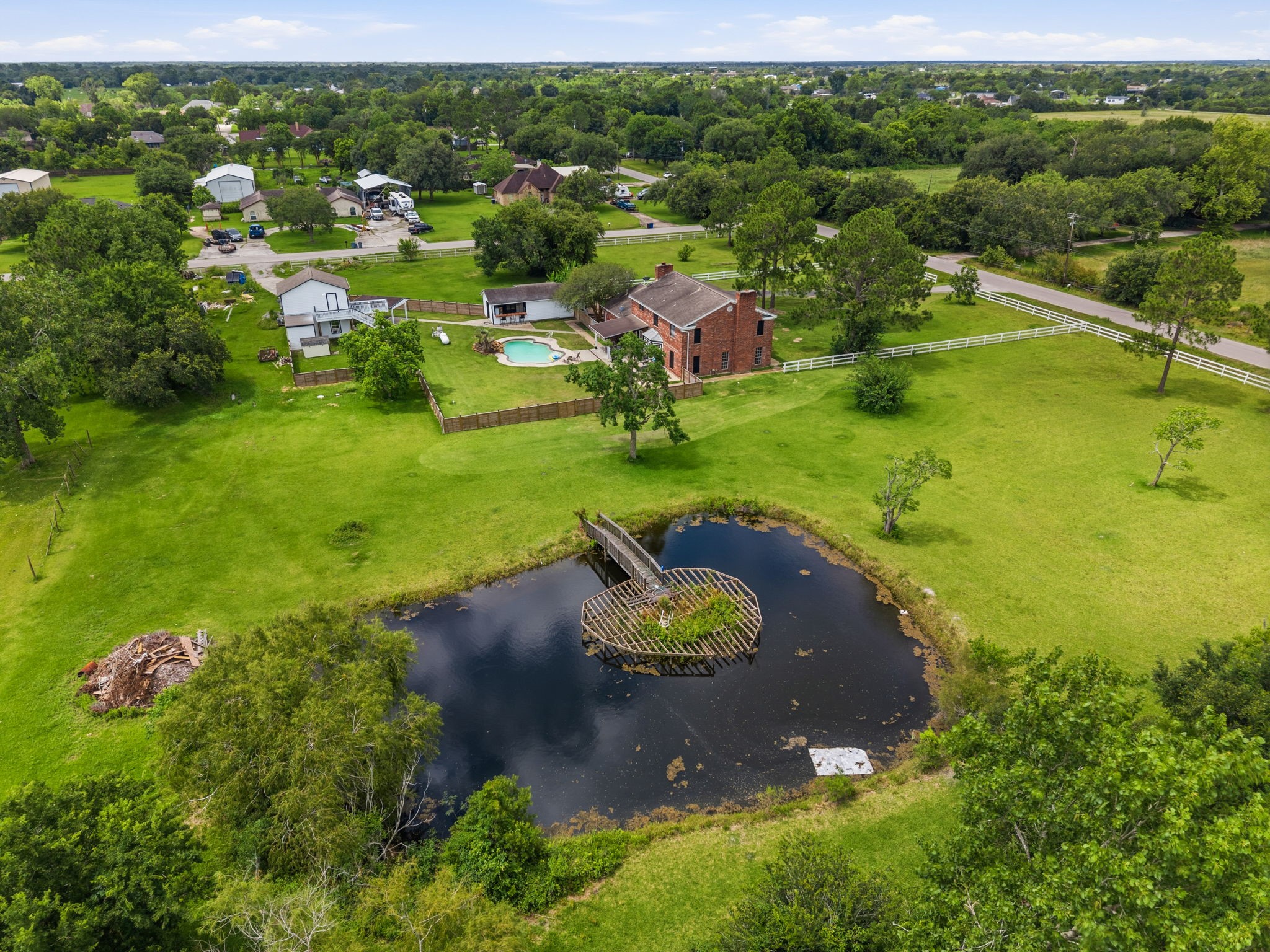 Property is fenced and cross fenced. Pond area has a bridge for fishing!