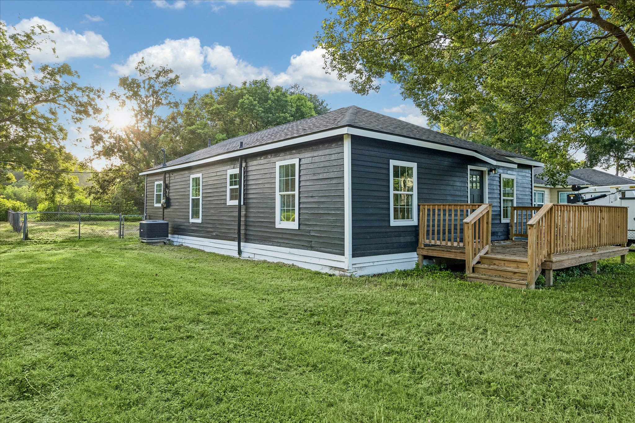 Fresh exterior paint, a new roof, and inviting front deck.