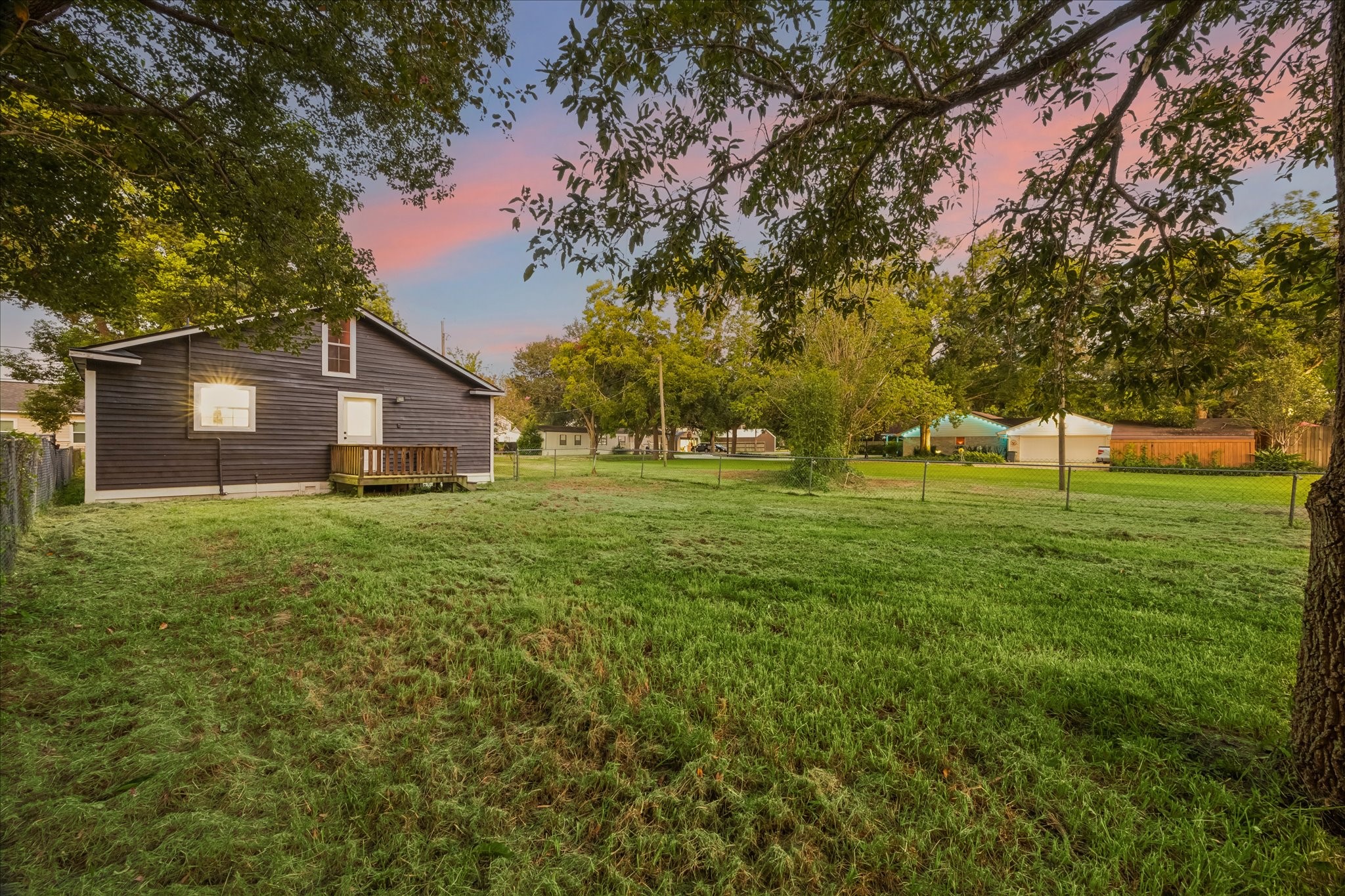 Peaceful backyard setting with mature trees and plenty of open lawn to enjoy.