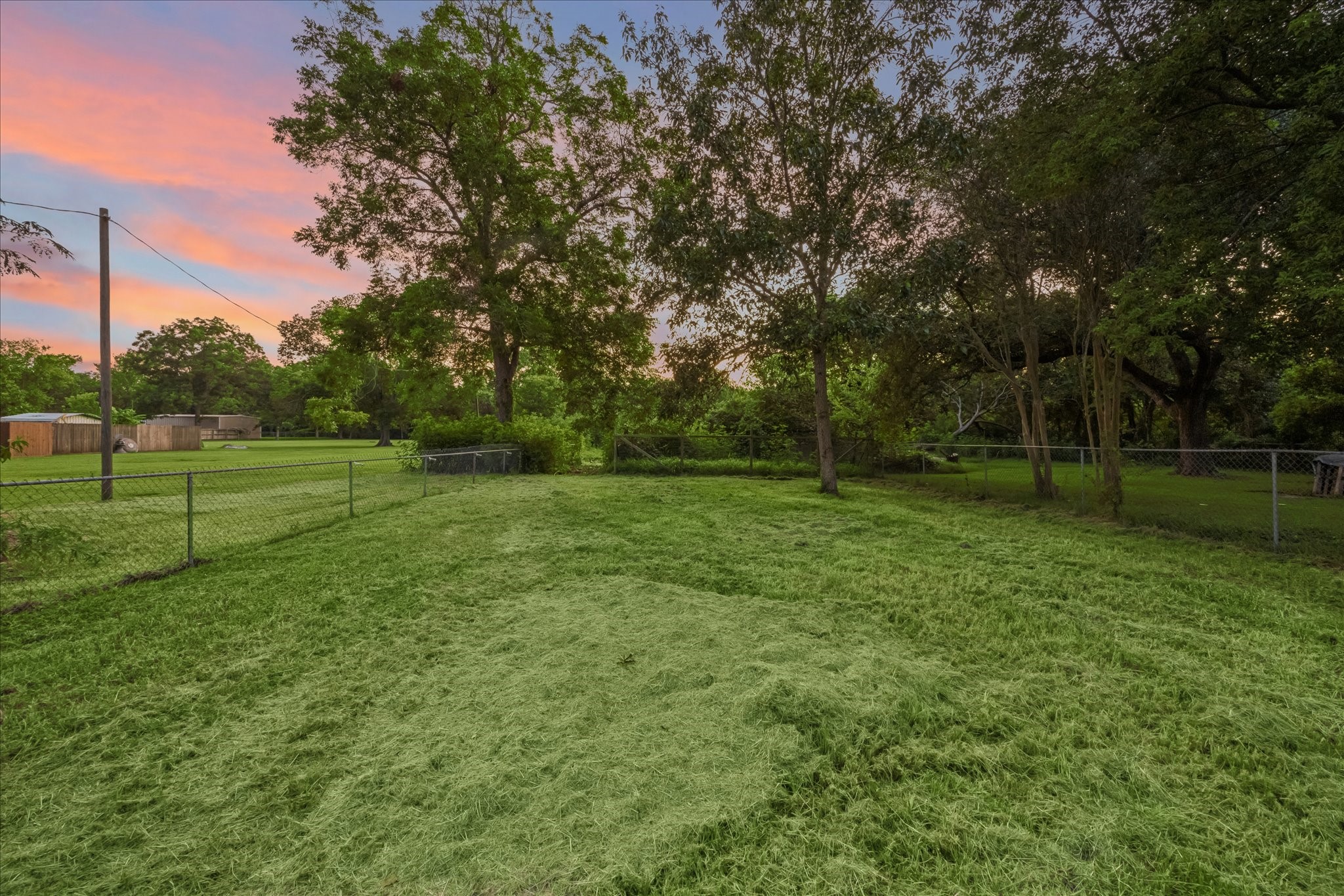 Expansive outdoor space. The rear 1/2 acre is also available for sale.