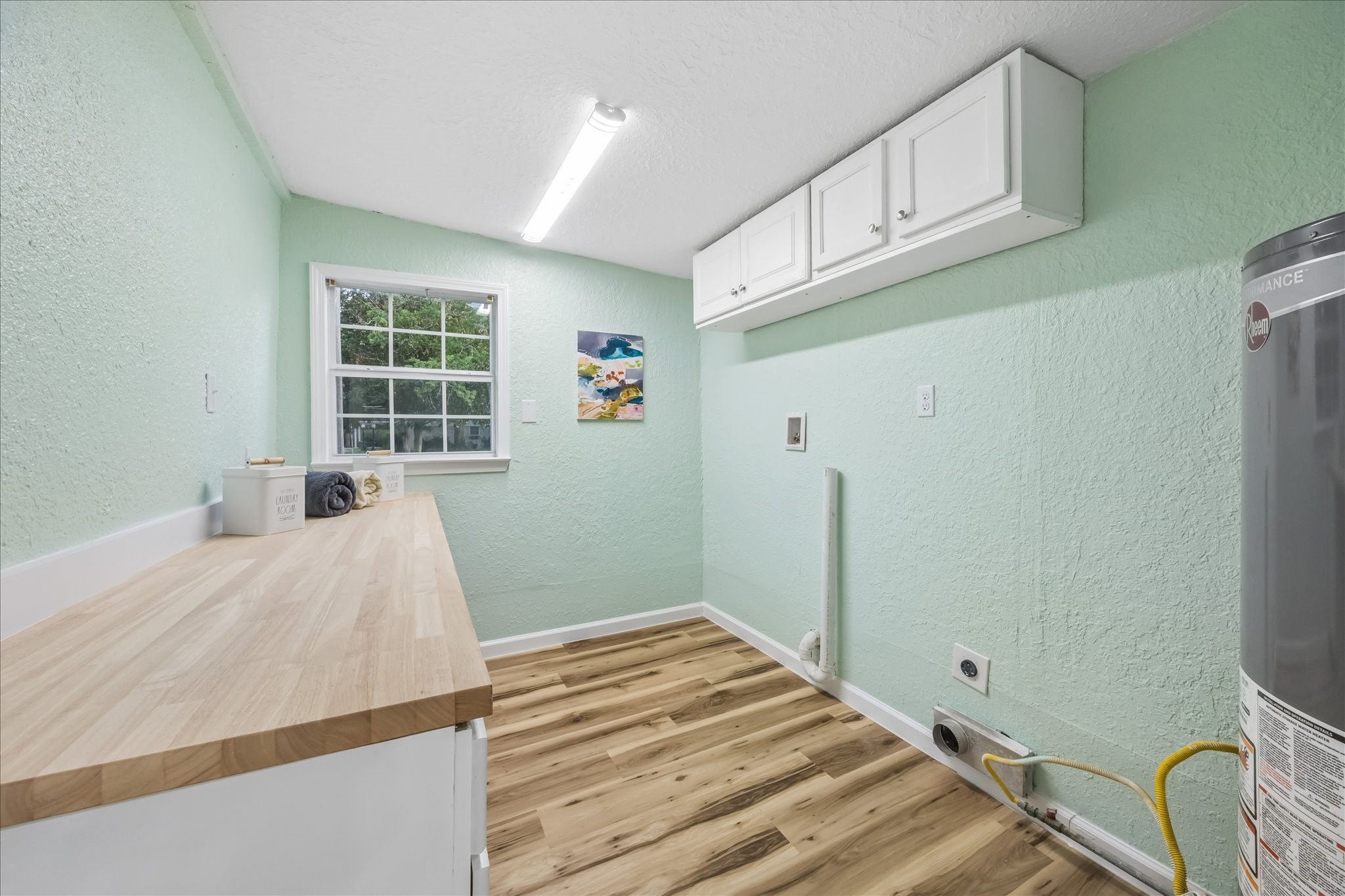 Reconfigured utility room with added countertop and storage.