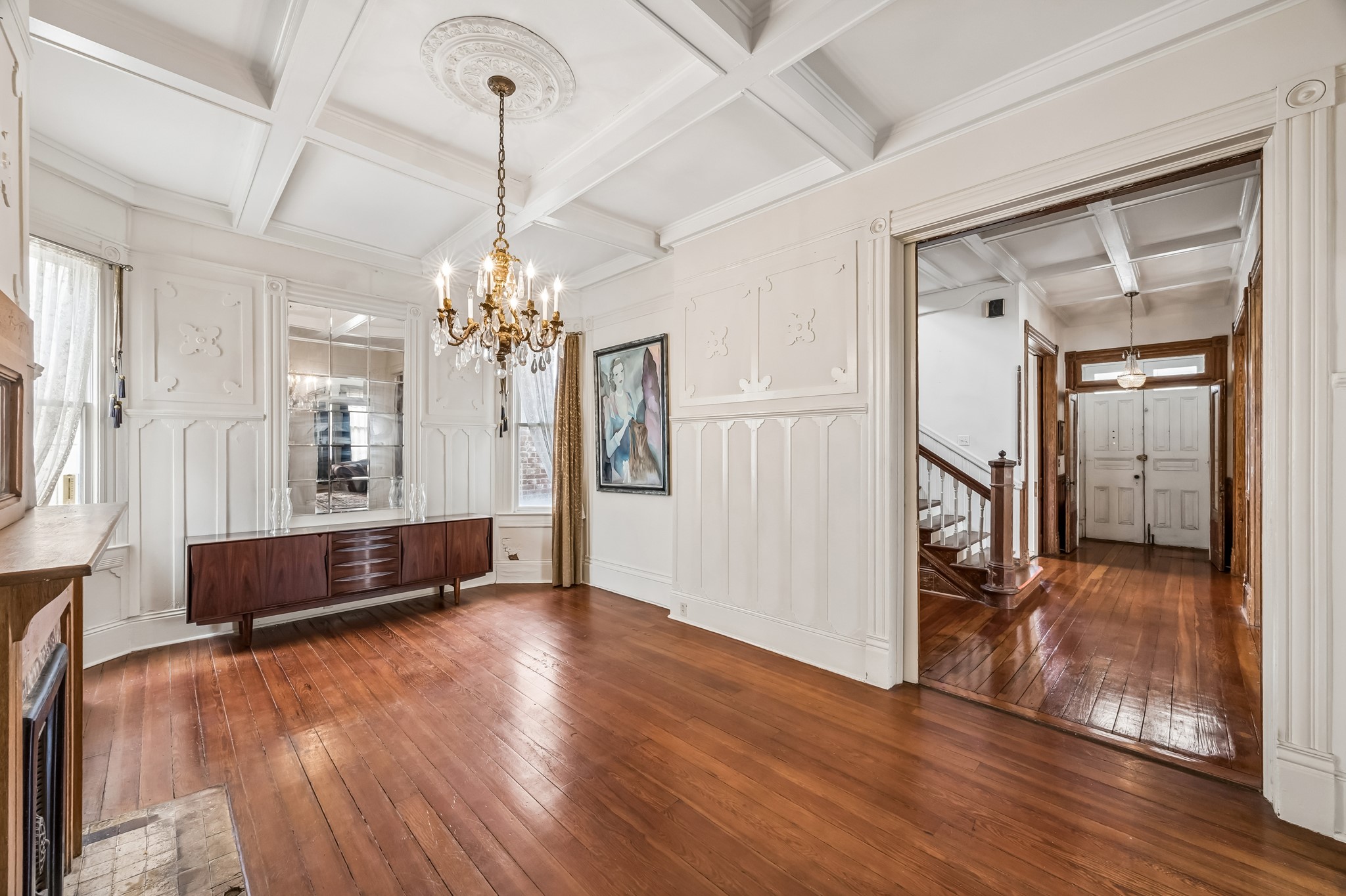 The formal dining room can accommodate your largest dining room table! More original details grace the walls and the ceiling.