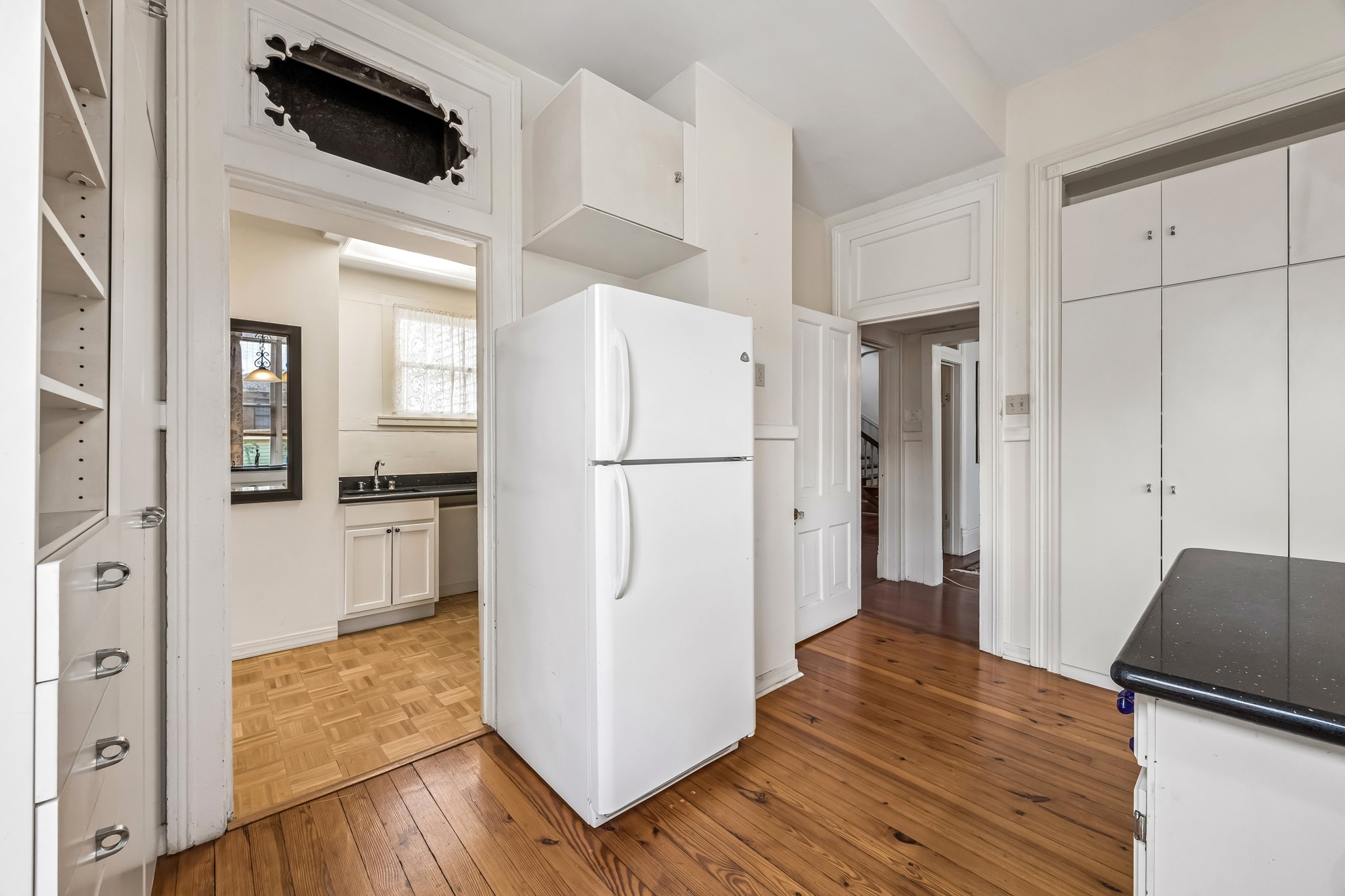 Go through the doorway to the cooking part of the kitchen