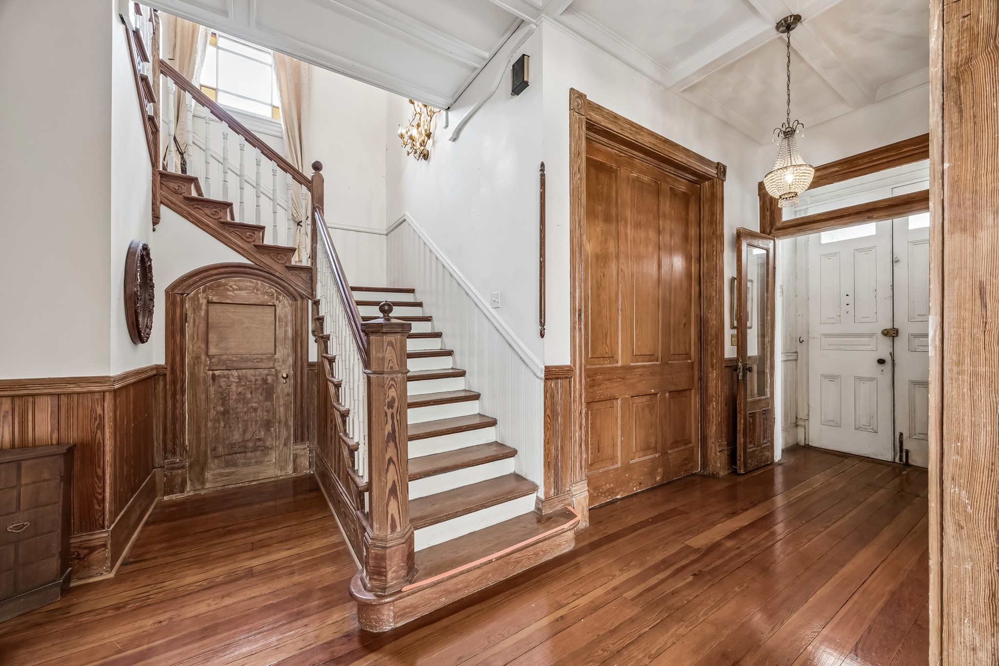 The massive pocket door closes off the office. All the details you see are original Gorgeous! The small door leads to a powder room that has a small shower around the corner. The massive pocket door closes off the office. All the details you see are original Gorgeous! The small door leads to a powder room that has a small shower around the corner.