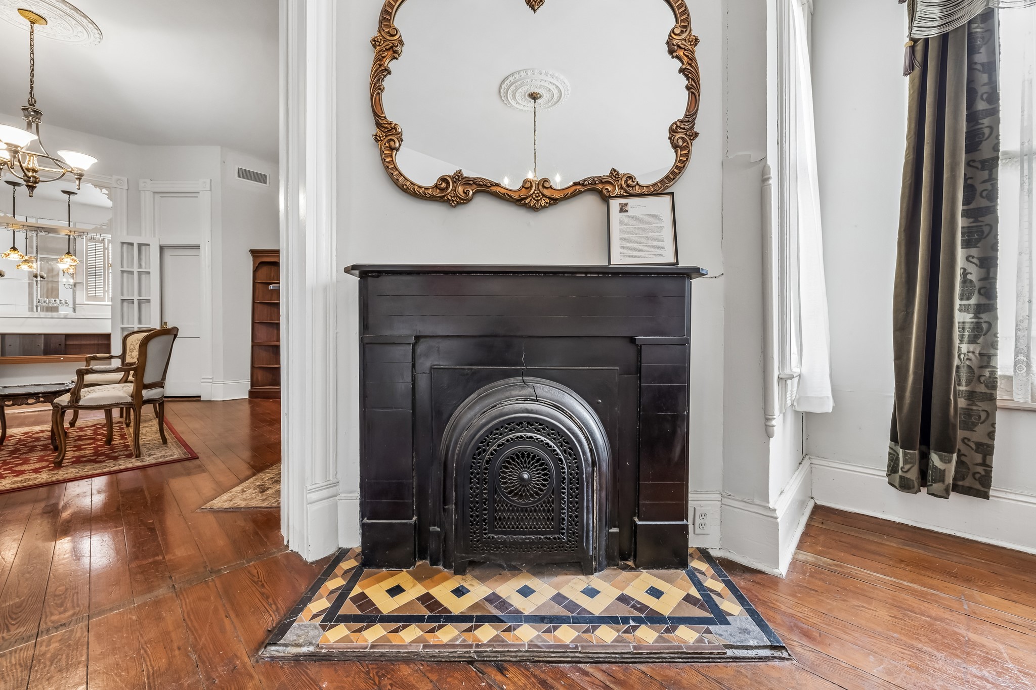The second of the three original coal burning fireplaces with original tile work