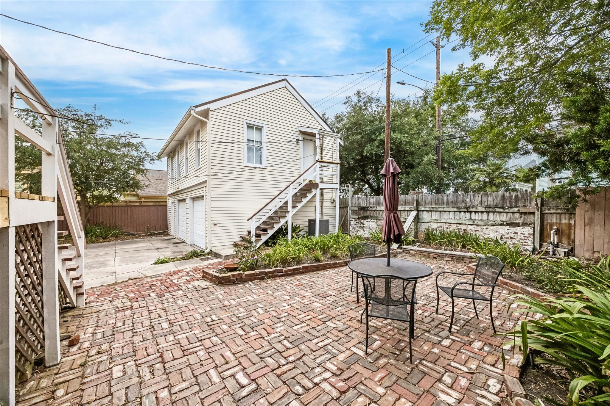 Large patio with vintage brick and a lovely garden. Perfect for enjoying a cup of tea or a glass of wine.